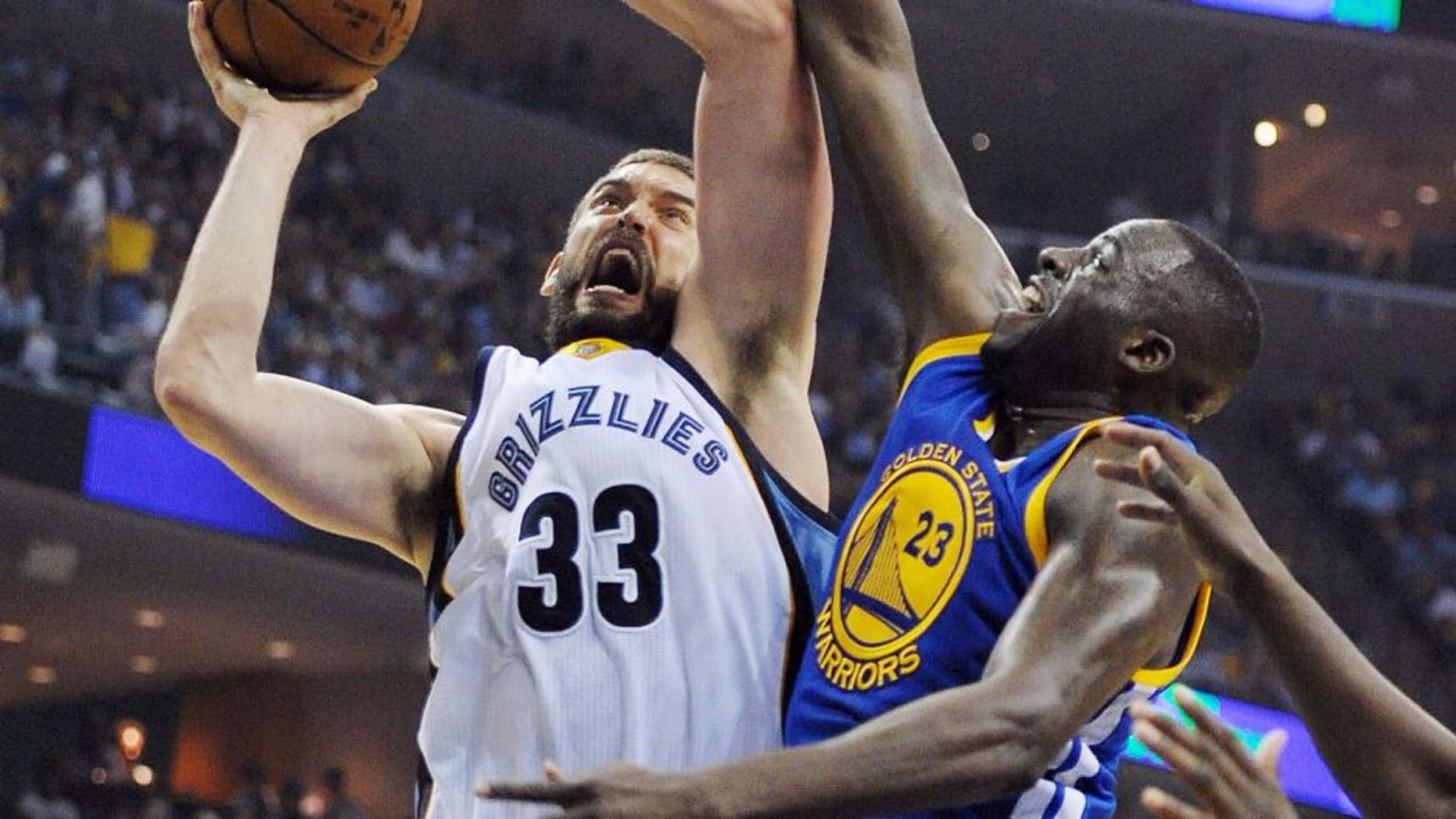 May 9, 2015; Memphis, TN, USA; Memphis Grizzlies center Marc Gasol (33) goes to the basket against Golden State Warriors forward Draymond Green (23) during game three of the second round of the NBA Playoffs at FedExForum. Mandatory Credit: Justin Ford-USA TODAY Sports