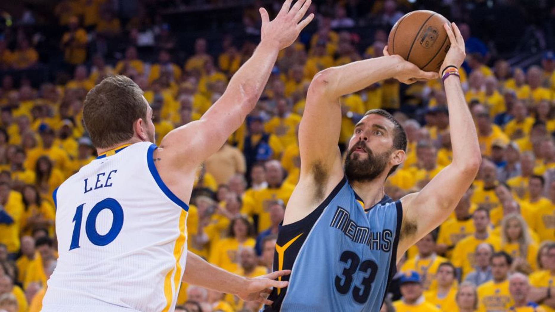 May 13, 2015; Oakland, CA, USA; Memphis Grizzlies center Marc Gasol (33) shoots the basketball against Golden State Warriors forward David Lee (10) during the fourth quarter in game five of the second round of the NBA Playoffs at Oracle Arena. The Warriors defeated the Grizzlies 98-78. Mandatory Credit: Kyle Terada-USA TODAY Sports