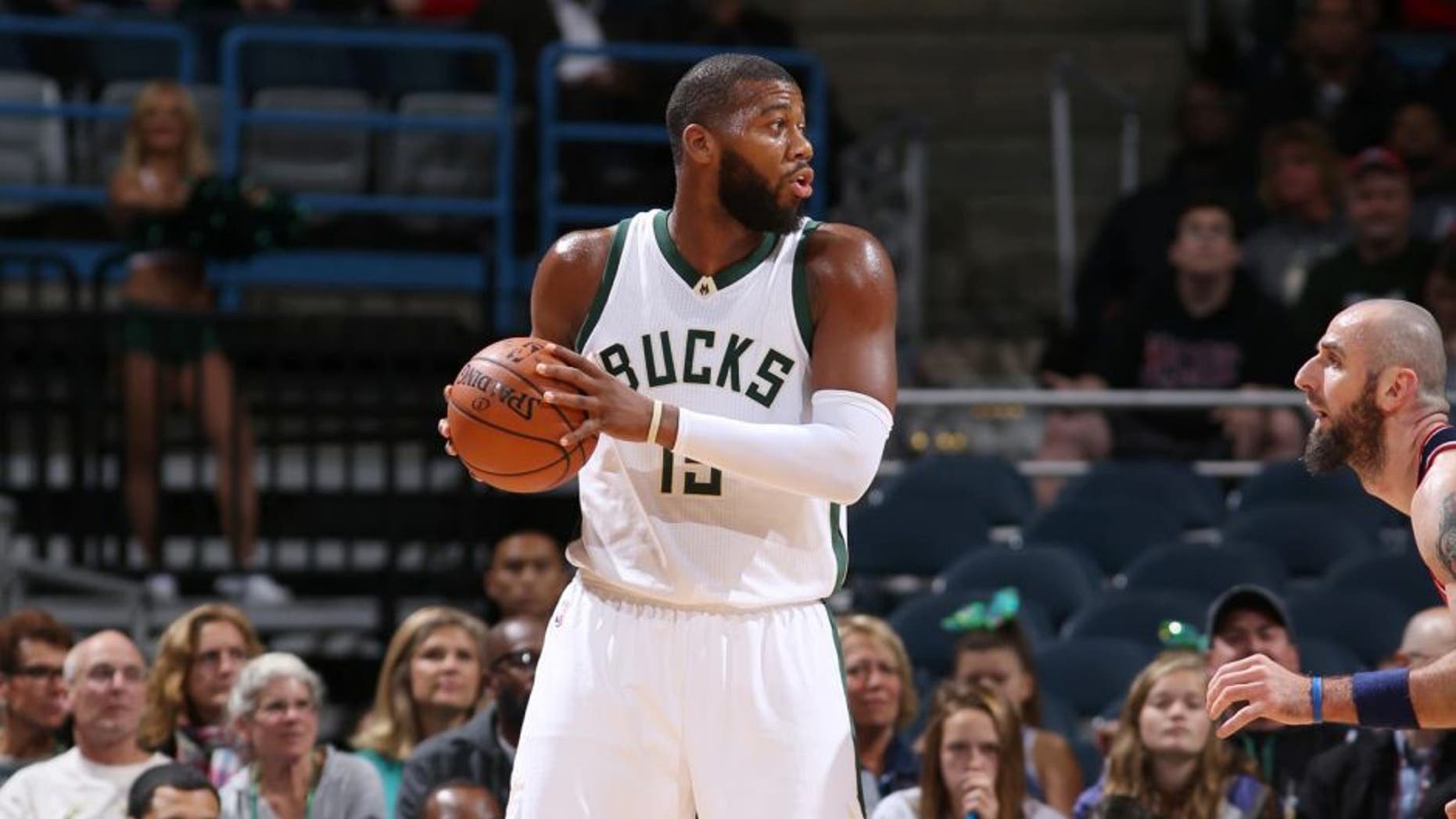 The Milwaukee Bucks' Greg Monroe handles the ball against the Washington Wizards during a preseason game Oct. 17, 2015, at the BMO Harris Bradley Center in Milwaukee, Wis.