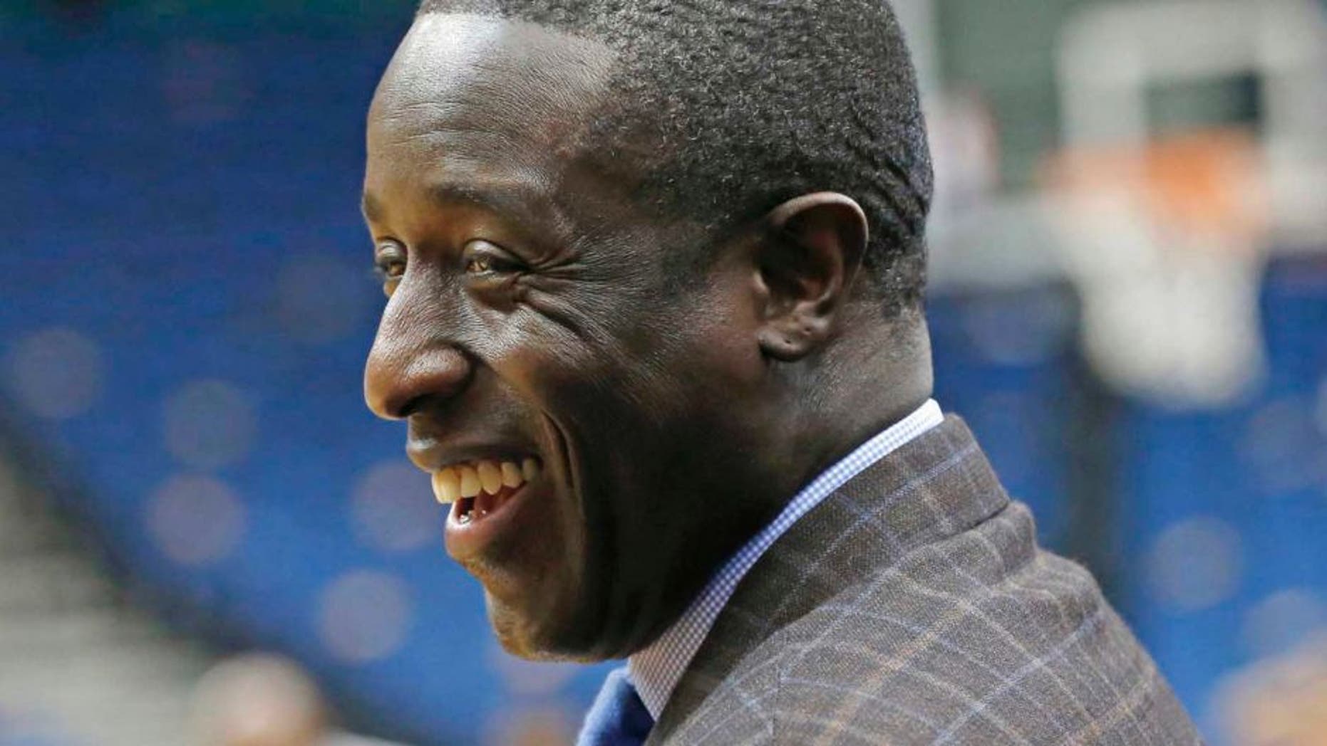 Minnesota Timberwolves general manager Milt Newton smiles prior to the Timberwolves' game against the Hawks in Minneapolis on Wednesday, Nov. 25, 2015. Newton has risen up the ranks to become one of five African-Americans with final decision-making power in the NBA and is wrestling with the excitement for his opportunity and the grief for how it came about after the death of coach Flip Saunders.