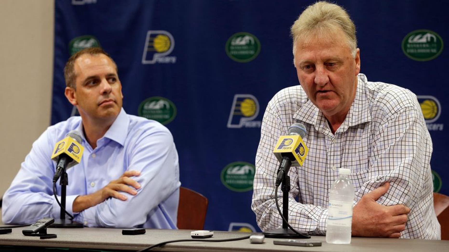 Indiana Pacers President of Basketball Operations Larry Bird, right, and head coach Frank Vogel talk about the injury to player Paul George during a press conference in Indianapolis, Tuesday, Aug. 12, 2014. (AP Photo/Michael Conroy)