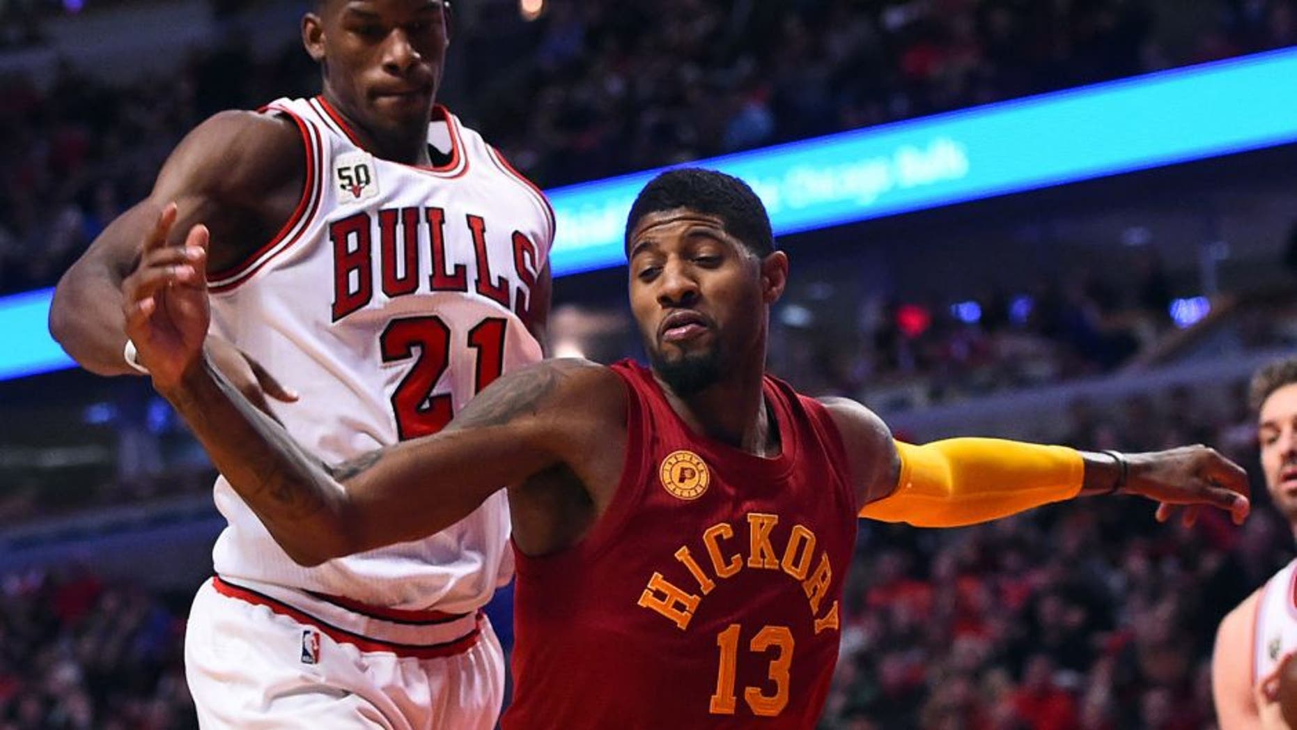 Dec 30, 2015; Chicago, IL, USA; Indiana Pacers forward Paul George (13) knocks the ball away from Chicago Bulls guard Jimmy Butler (21) during the second half at the United Center. Mandatory Credit: Mike DiNovo-USA TODAY Sports