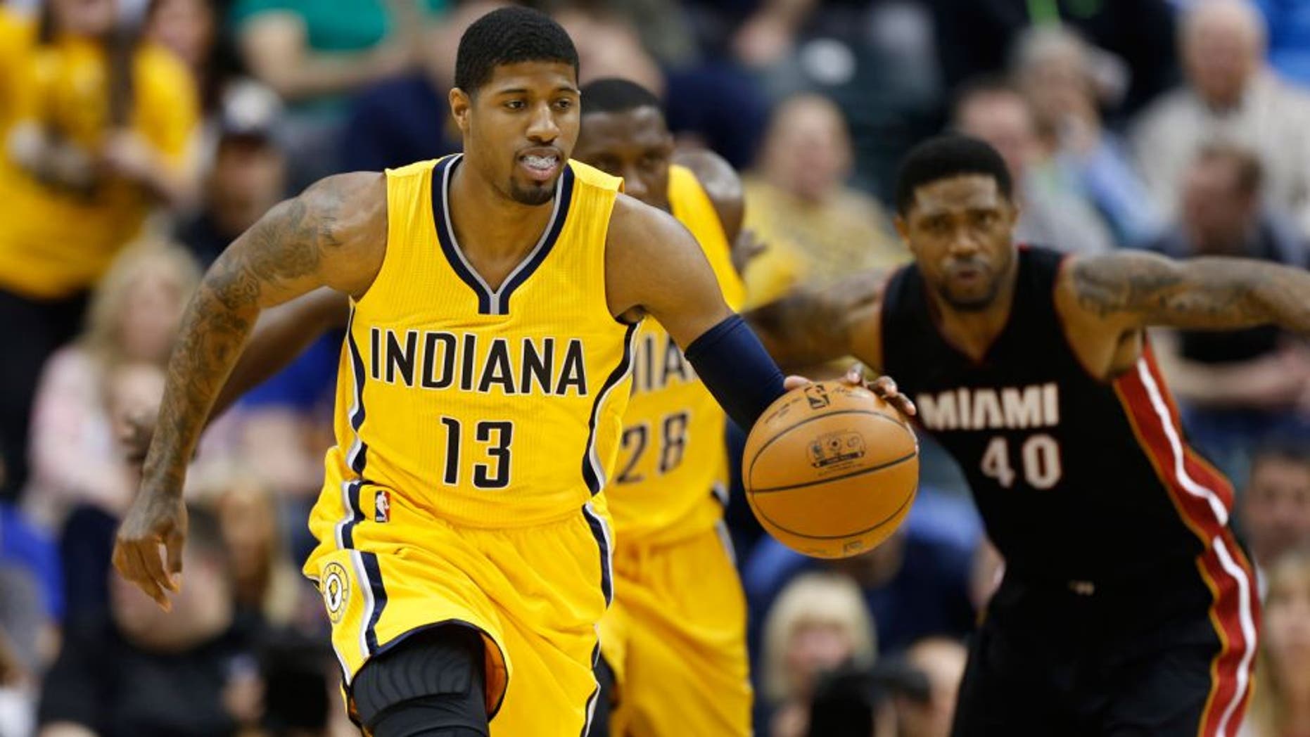 Apr 5, 2015; Indianapolis, IN, USA; Indiana Pacers forward Paul George (13) leads a fast break against the Miami Heat at Bankers Life Fieldhouse. Indiana defeats Miami 112-89. Mandatory Credit: Brian Spurlock-USA TODAY Sports