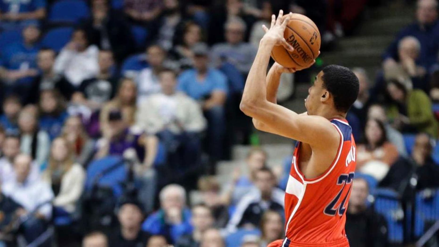 The Washington Wizards' Otto Porter Jr. shoots a jumper against the Minnesota Timberwolves during the first quarter of an NBA basketball game, Friday, Dec. 27, 2013, in Minneapolis.