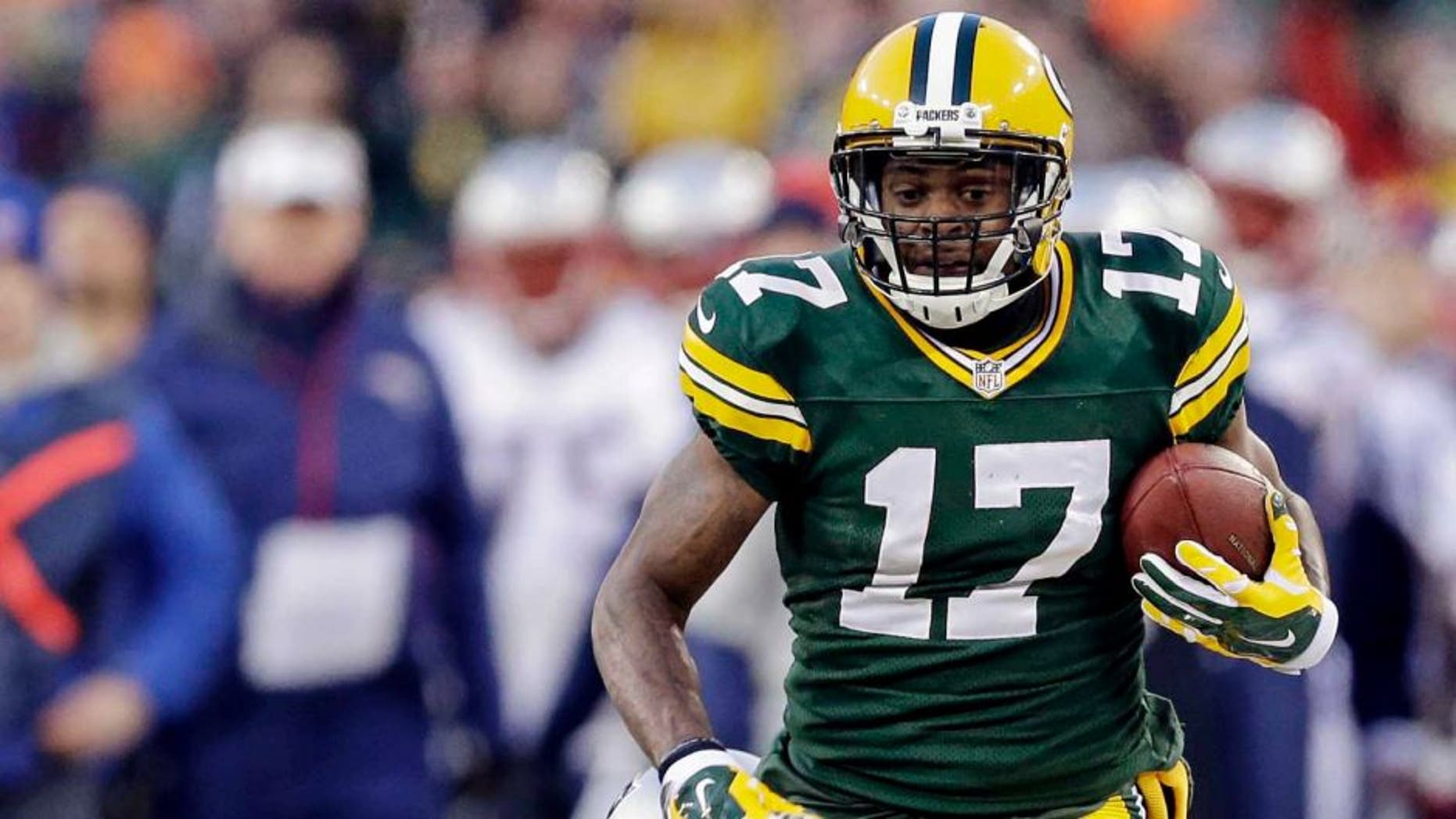 The Green Bay Packers' Davante Adams tries to break away from the New England Patriots' Logan Ryan (below, out of frame) during the first half.