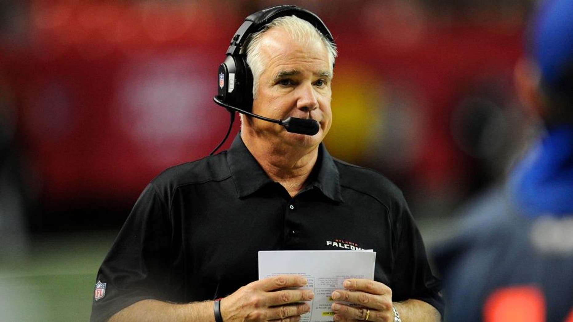 Dec 15, 2013; Atlanta, GA, USA; Atlanta Falcons head coach Mike Smith shown on the sideline against the Washington Redskins during the second half at the Georgia Dome. The Falcons defeated the Redskins 27-26. Mandatory Credit: Dale Zanine-USA TODAY Sports