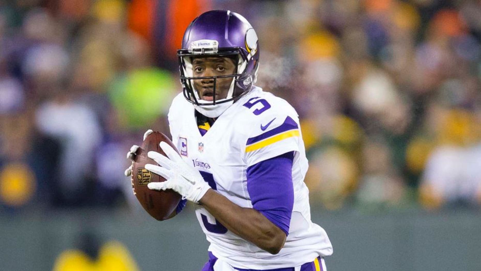 Minnesota Vikings quarterback Teddy Bridgewater looks to pass during the first quarter against the Green Bay Packers at Lambeau Field in Green Bay, Wis., on Sunday, Jan. 3, 2016.