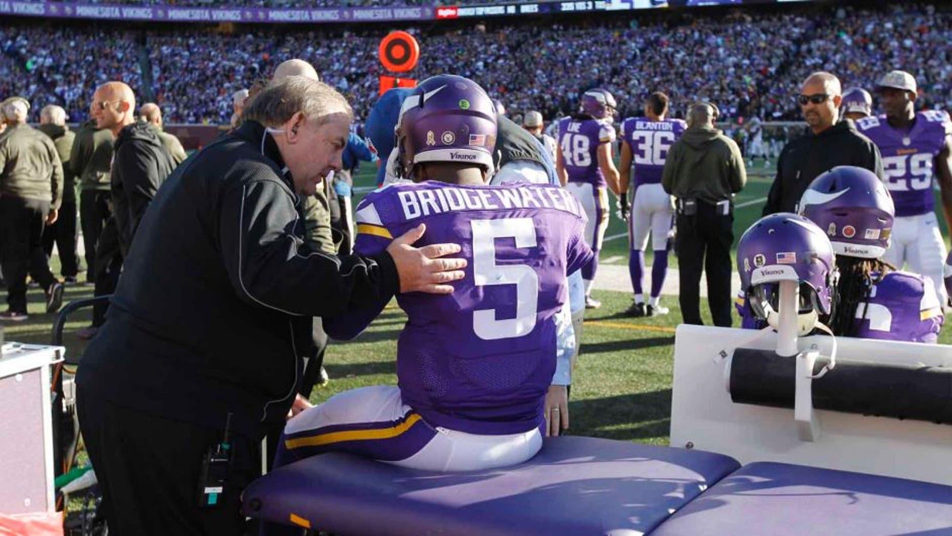 Minnesota Vikings quarterback Teddy Bridgewater is examined during the second half against the St. Louis Rams on Sunday, Nov. 8, 2015, in Minneapolis.