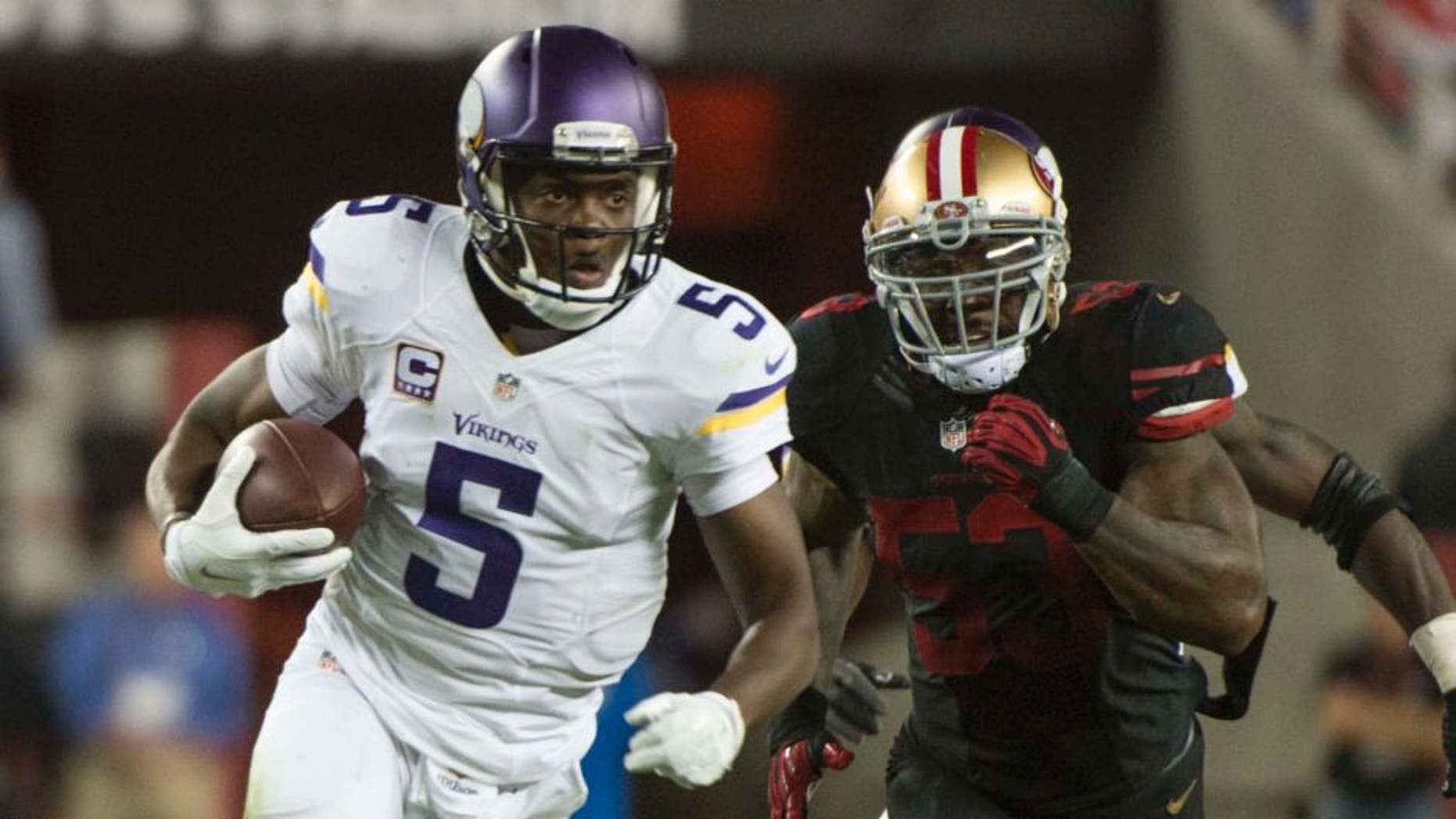 Minnesota Vikings quarterback Teddy Bridgewater runs with the football past San Francisco 49ers inside linebacker NaVorro Bowman during the third quarter at Levi's Stadium in Santa Clara, Calif., on Monday, Sept. 14, 2015.
