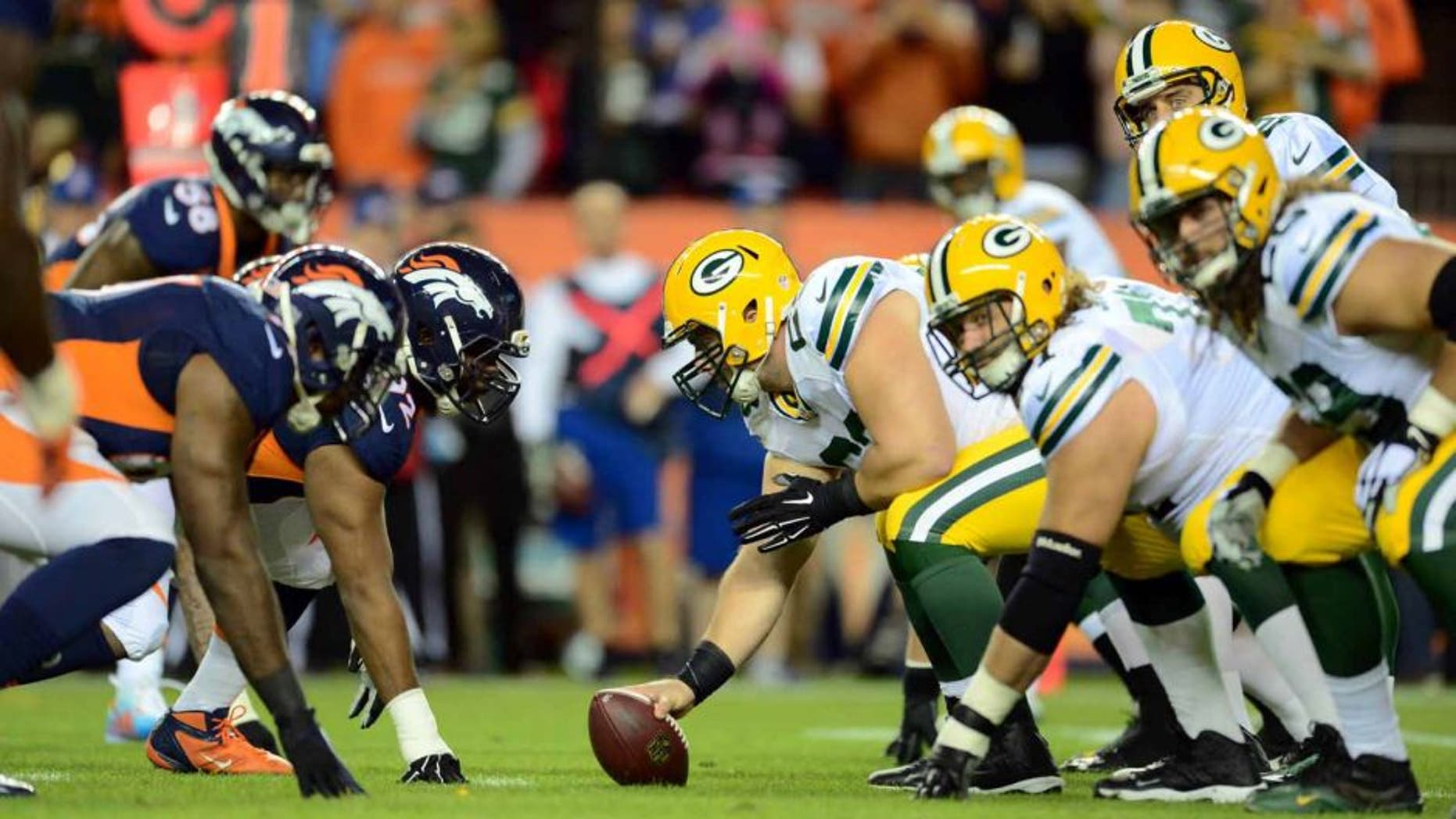 Green Bay Packers center Corey Linsley lines up to hike the football across from the Denver Broncos in the first quarter at Sports Authority Field at Mile High in Denver on Sunday, Nov. 1, 2015.