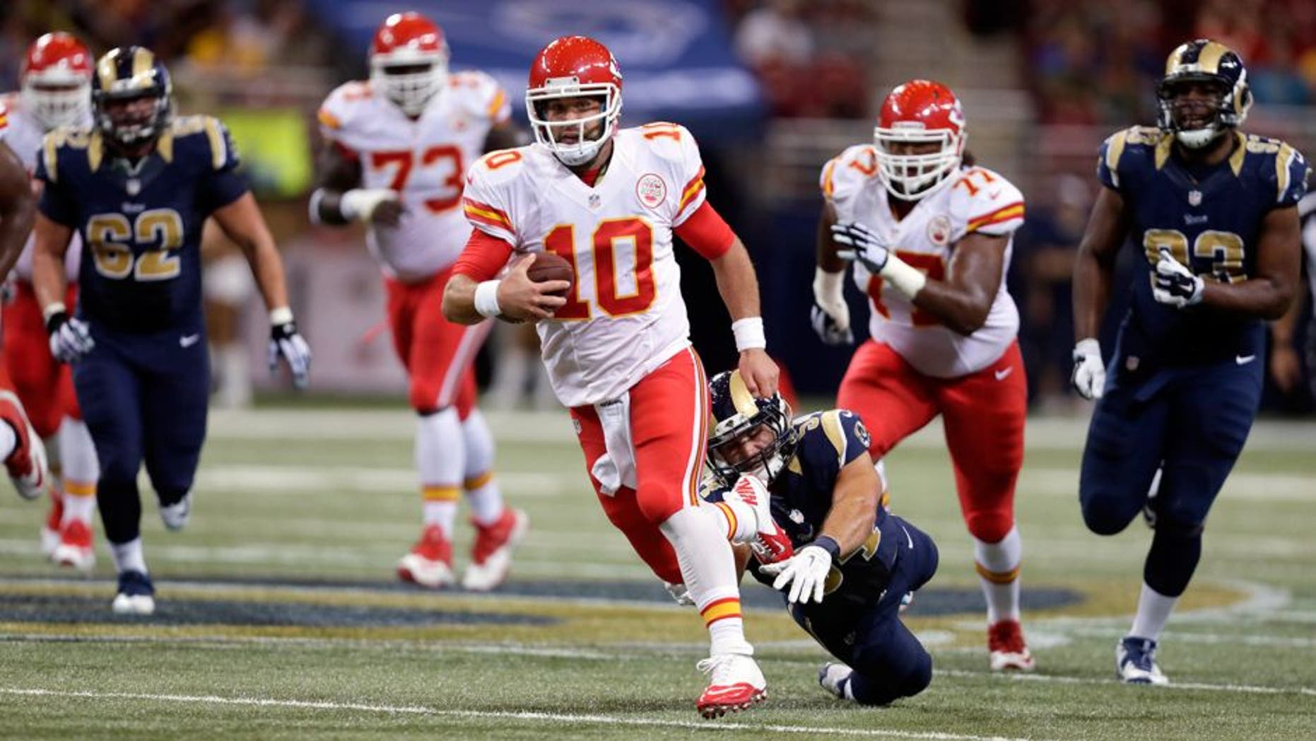 Kansas City Chiefs quarterback Chase Daniel scrambles for a 14-yard gain during the second quarter of an NFL preseason football game against the St. Louis Rams Thursday, Sept. 3, 2015, in St. Louis. (AP Photo/Tom Gannam)