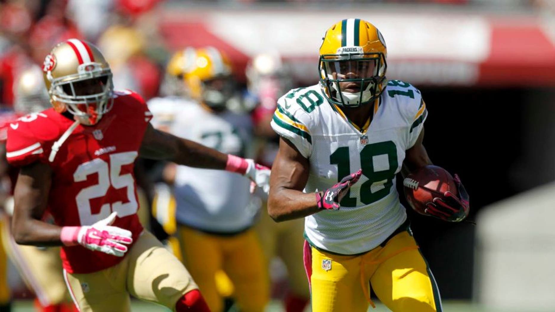 Green Bay Packers wide receiver Randall Cobb runs with the ball after making a catch against the San Francisco 49ers in the first quarter at Levi's Stadium in Santa Clara, Calif., on Sunday, Oct. 4, 2015.