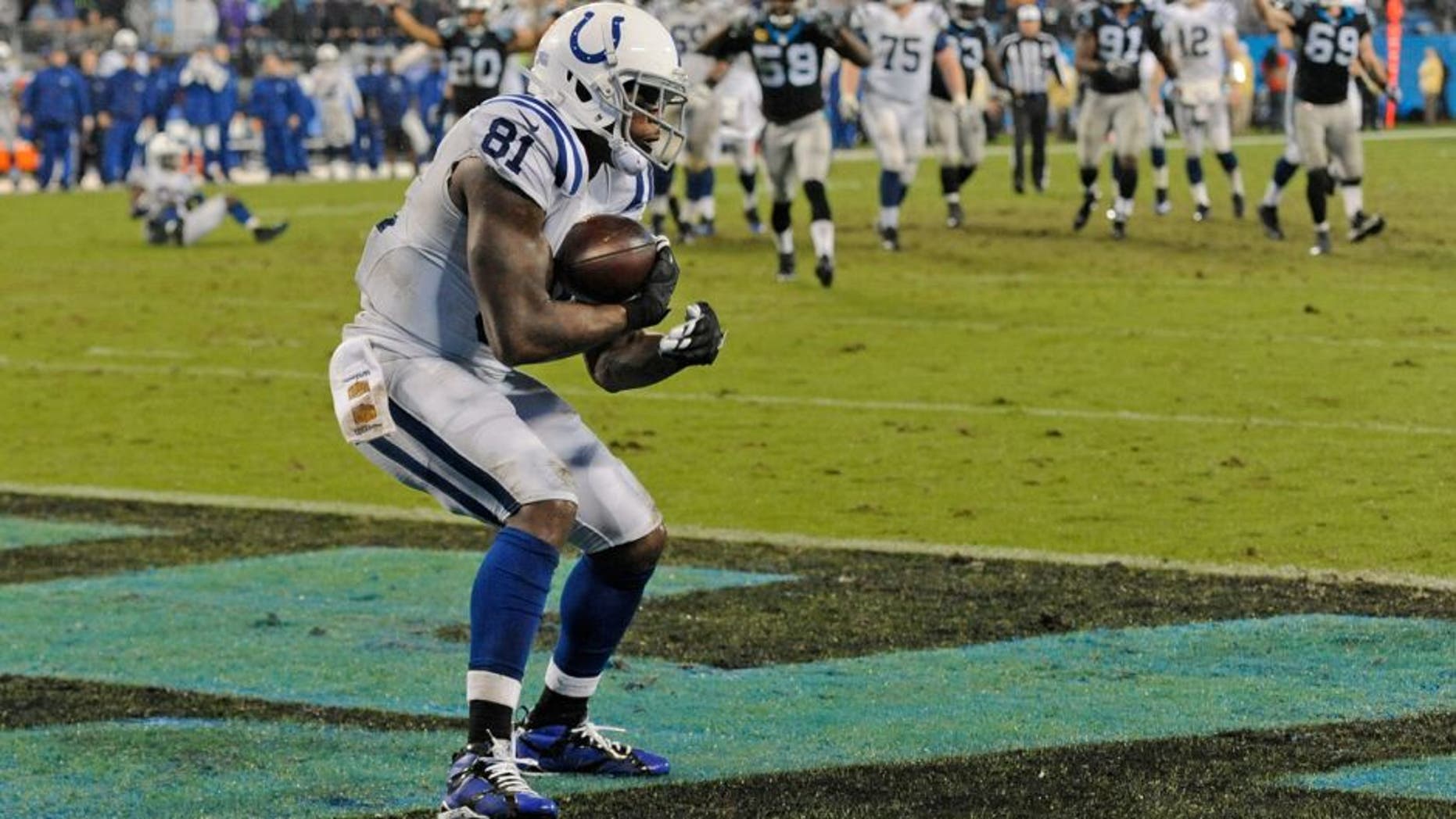 Indianapolis Colts' Andre Johnson (81) catches a touchdown pass against the Carolina Panthers in the second half of an NFL football game in Charlotte, N.C., Monday, Nov. 2, 2015. (AP Photo/Mike McCarn)