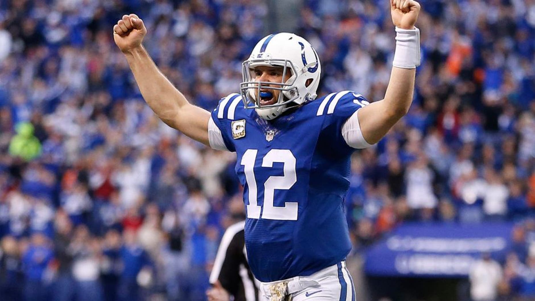 Indianapolis Colts quarterback Andrew Luck celebrates after Jack Doyle scored on a three yard touchdown reception during the first half of an NFL football game against the Denver Broncos, Sunday, Nov. 8, 2015, Indianapolis. (AP Photo/AJ Mast)
