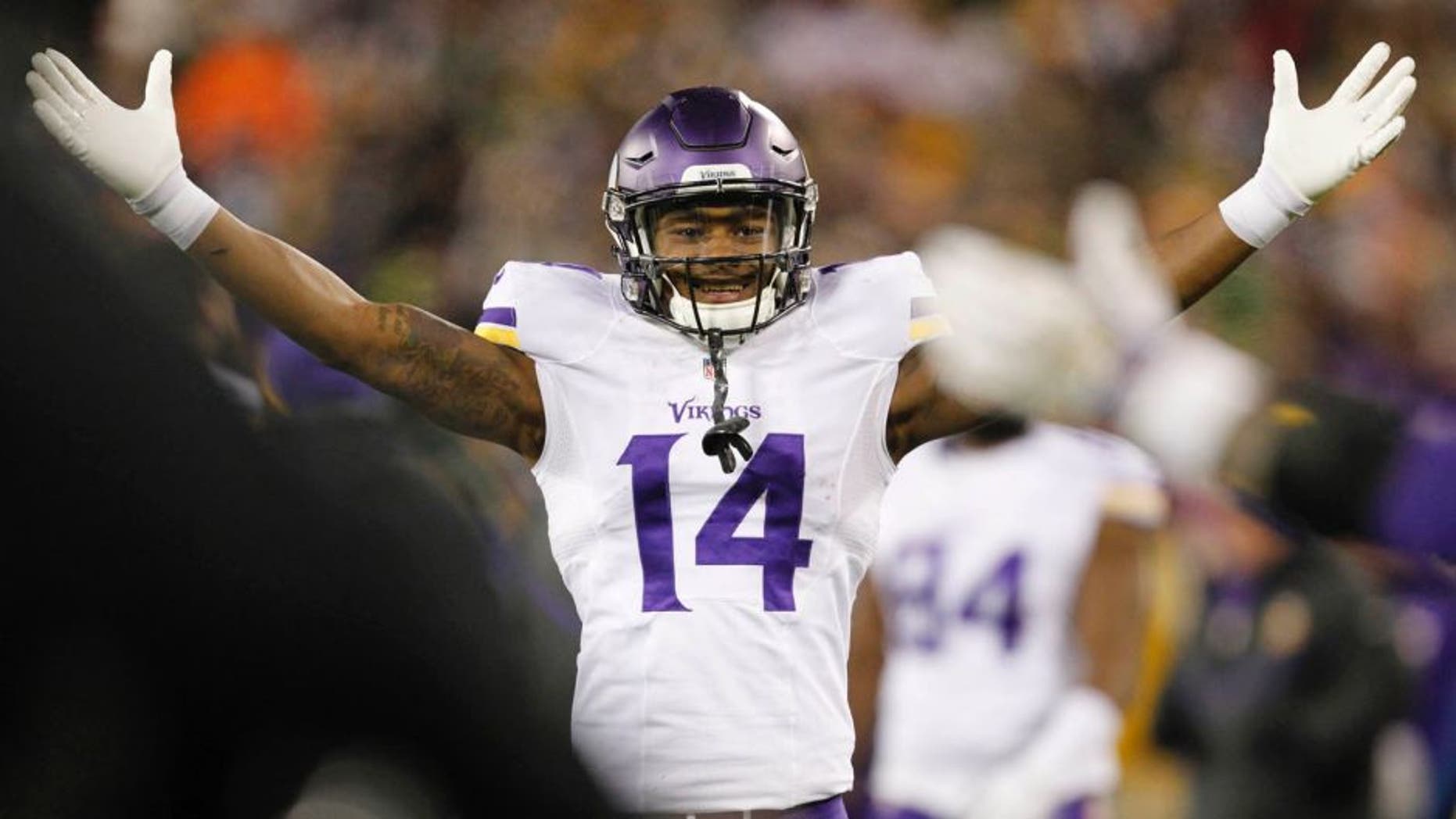 The Minnesota Vikings' Stefon Diggs celebrates during the second half against the Green Bay Packers on Sunday, Jan. 3, 2016, in Green Bay, Wis.