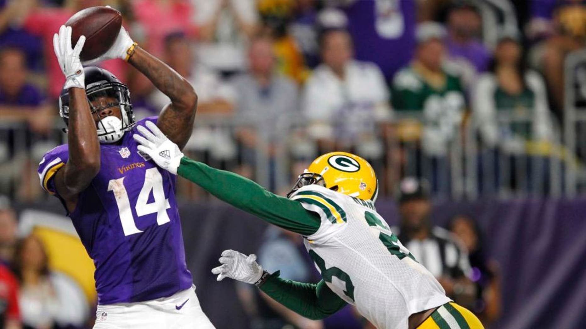 Minnesota Vikings wide receiver Stefon Diggs catches a 25-yard touchdown pass over Green Bay Packers cornerback Damarious Randall during the second half Sunday, Sept. 18, 2016, in Minneapolis.