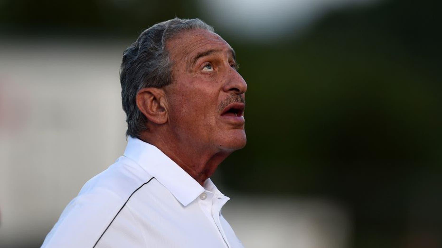 Aug 1, 2014; Lawrenceville, GA, USA; Atlanta Falcons team owner Arthur Blank watches skydivers land on the field during Atlanta Falcons practice during Falcons Friday Night Lights at Archer High School. Mandatory Credit: Dale Zanine-USA TODAY Sports