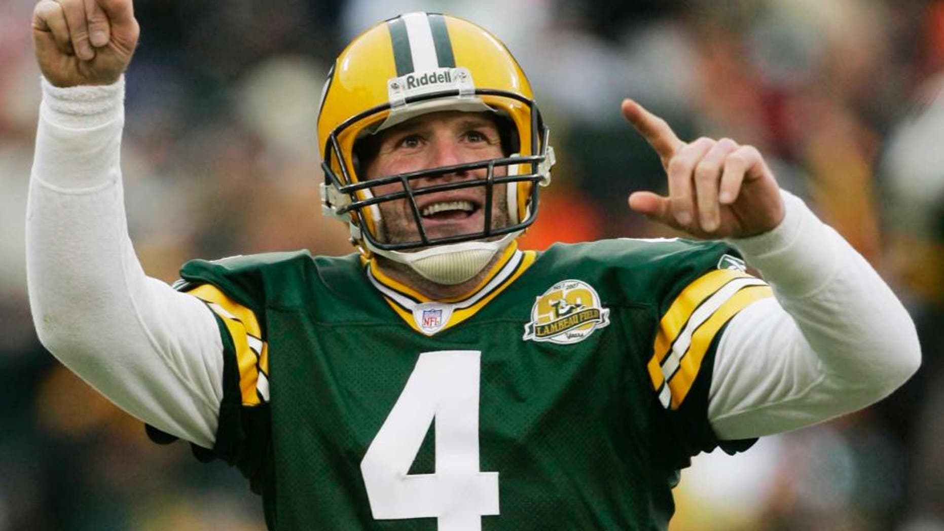 FILE - In this Dec. 9, 2007 file photo, Green Bay Packers quarterback Brett Favre reacts to a 46-yard touchdown pass to tight end Donald Lee during the second half of an NFL football game against the Oakland Raiders in Green Bay, Wis. Favre will be inducted into the team's Hall of Fame and have his jersey retired next year. Favre writes on his official website that it will be an honor to have his name placed among others such Bart Starr, Curly Lambeau, Ray Nitschke and Vince Lombardi, to name a few.