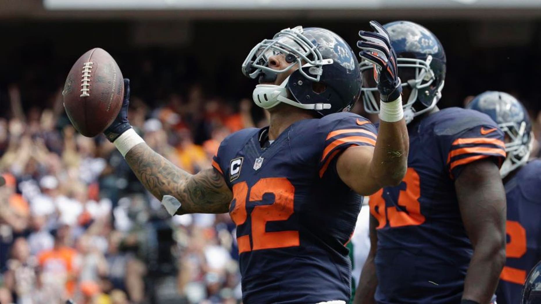 Chicago Bears running back Matt Forte celebrates a touchdown during the first half of an NFL football game against the Green Bay Packers, Sunday, Sept. 13, 2015, in Chicago.