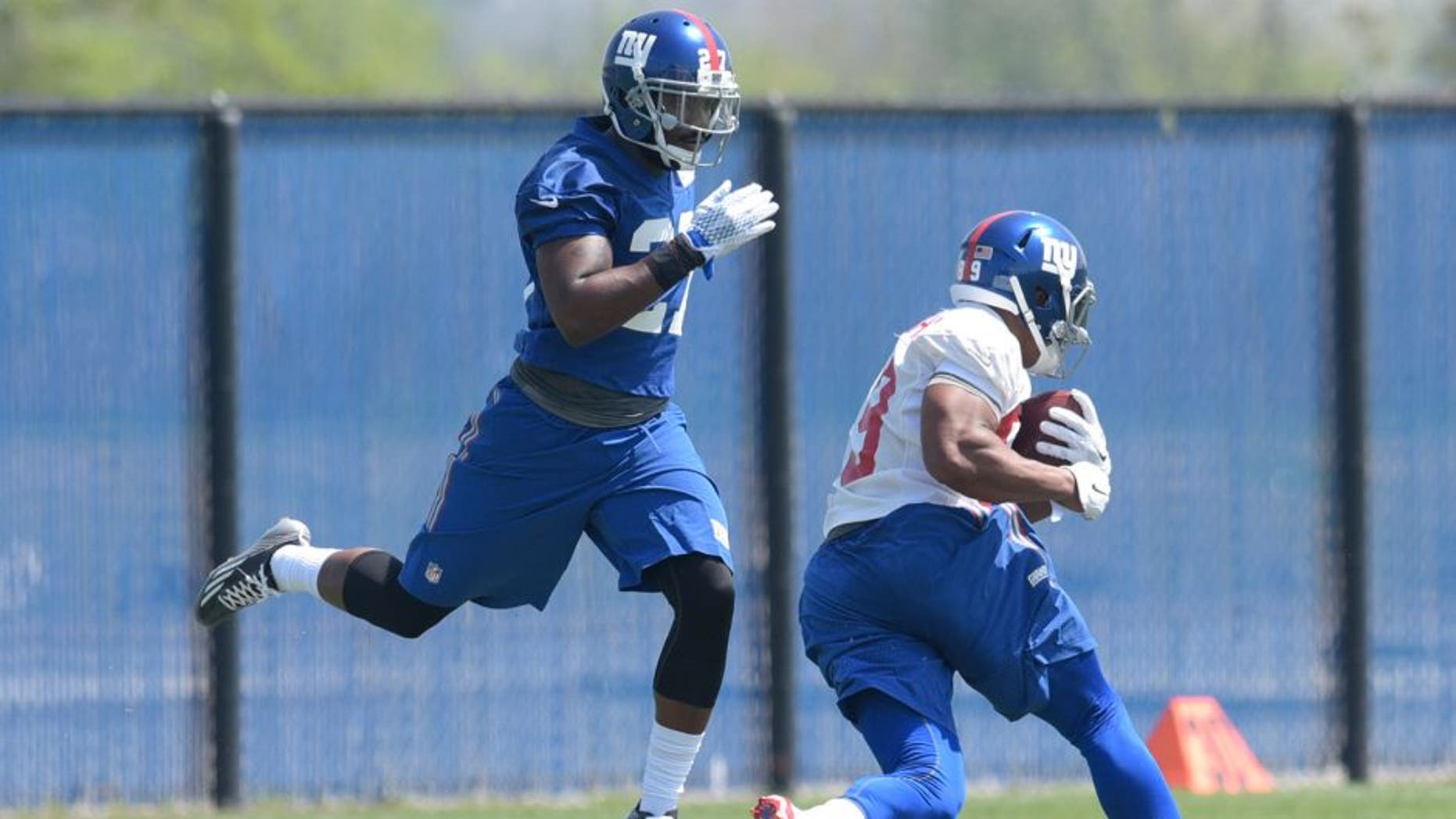 New York Giants second round draft pick Landon Collins, left, avoids a collision with Jerome Cunningham during practice at the team's NFL football rookie minicamp Friday, May 8, 2015, in East Rutherford, N.J. (AP Photo/Bill Kostroun)