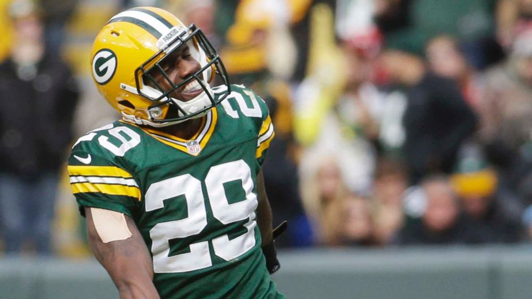 The Green Bay Packers' Casey Hayward celebrates after intercepting a pass during the second half against the Carolina Panthers.