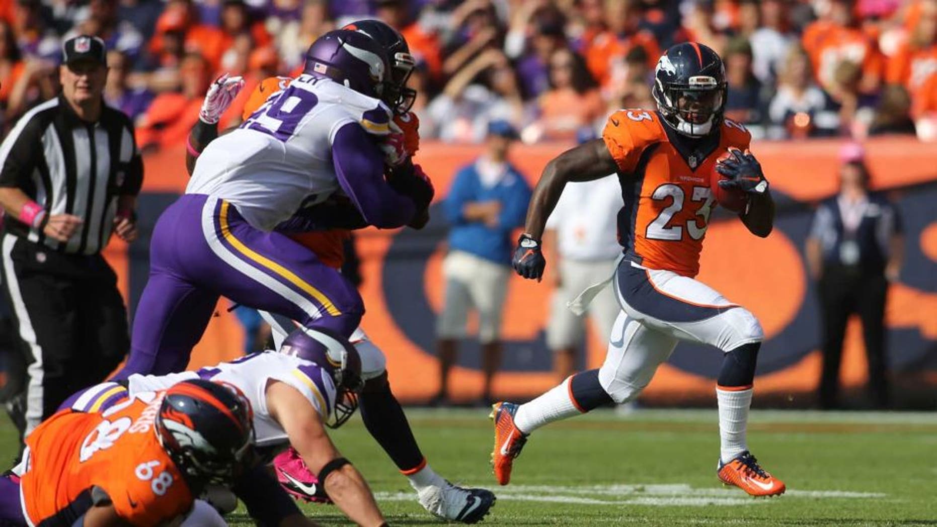 Denver Broncos running back Ronnie Hillman runs for a touchdown during the first half against the Minnesota Vikings at Sports Authority Field at Mile High in Denver on Sunday, Oct. 4, 2015.