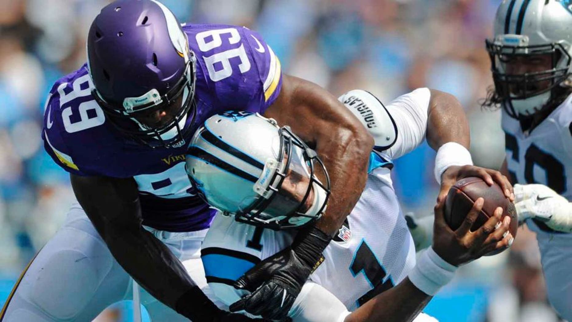 The Carolina Panthers' Cam Newton is sacked in the end zone for a safety by the Minnesota Vikings' Danielle Hunter in the first half in Charlotte, N.C., Sunday, Sept. 25, 2016.