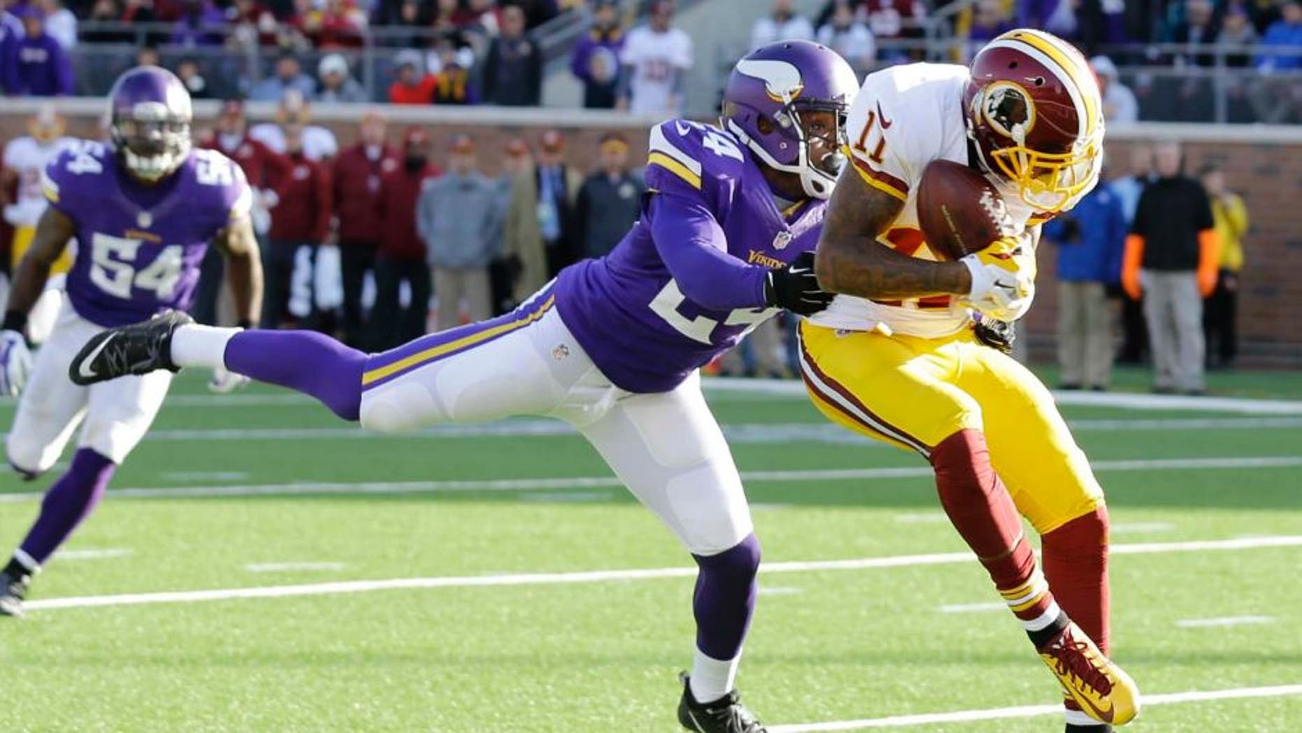 Washington Redskins wide receiver DeSean Jackson (right) catches a 13-yard touchdown pass in front of Minnesota Vikings cornerback Captain Munnerlyn during the second half.