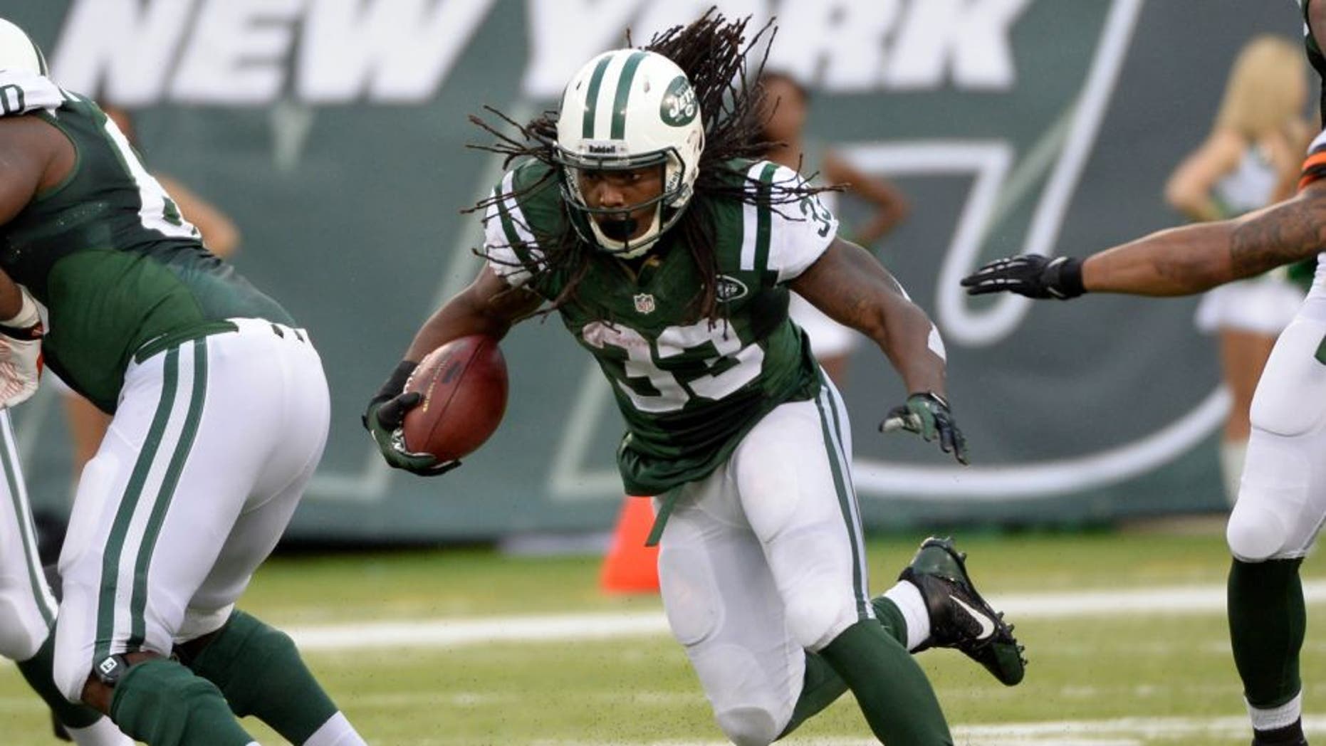 Dec 22, 2013; East Rutherford, NJ, USA; New York Jets running back Chris Ivory runs against the Cleveland Browns during the game at MetLife Stadium. Mandatory Credit: Robert Deutsch-USA TODAY Sports