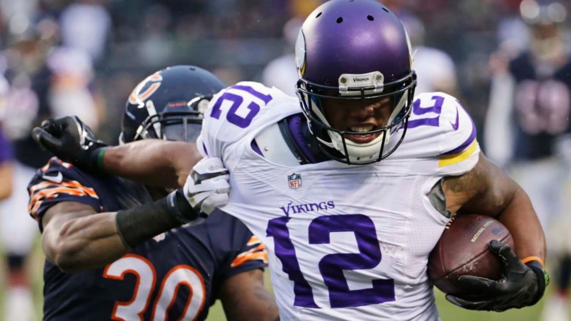 Minnesota Vikings receiver Charles Johnson (right) tries to avoid getting tackled by Chicago Bears cornerback Demontre Hurst during the second half.
