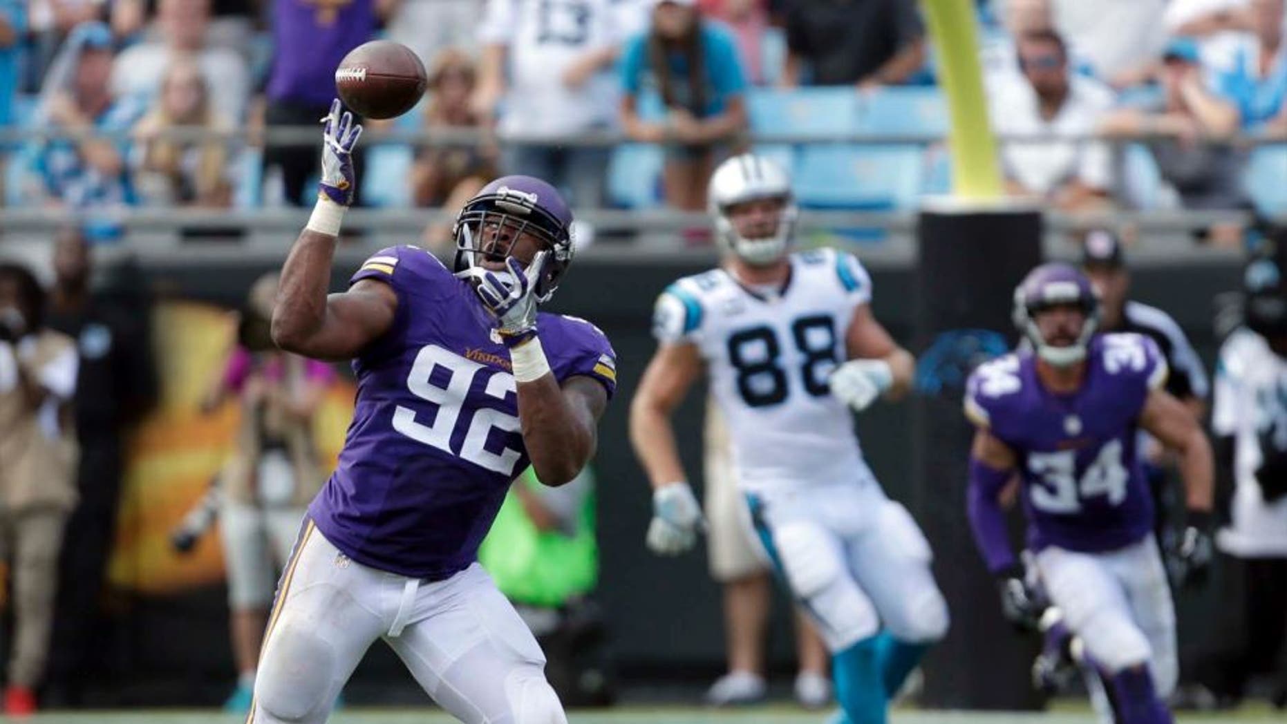 The Minnesota Vikings' Tom Johnson intercepts a Carolina Panthers pass in the second half in Charlotte, N.C., Sunday, Sept. 25, 2016. The Vikings won 22-10.