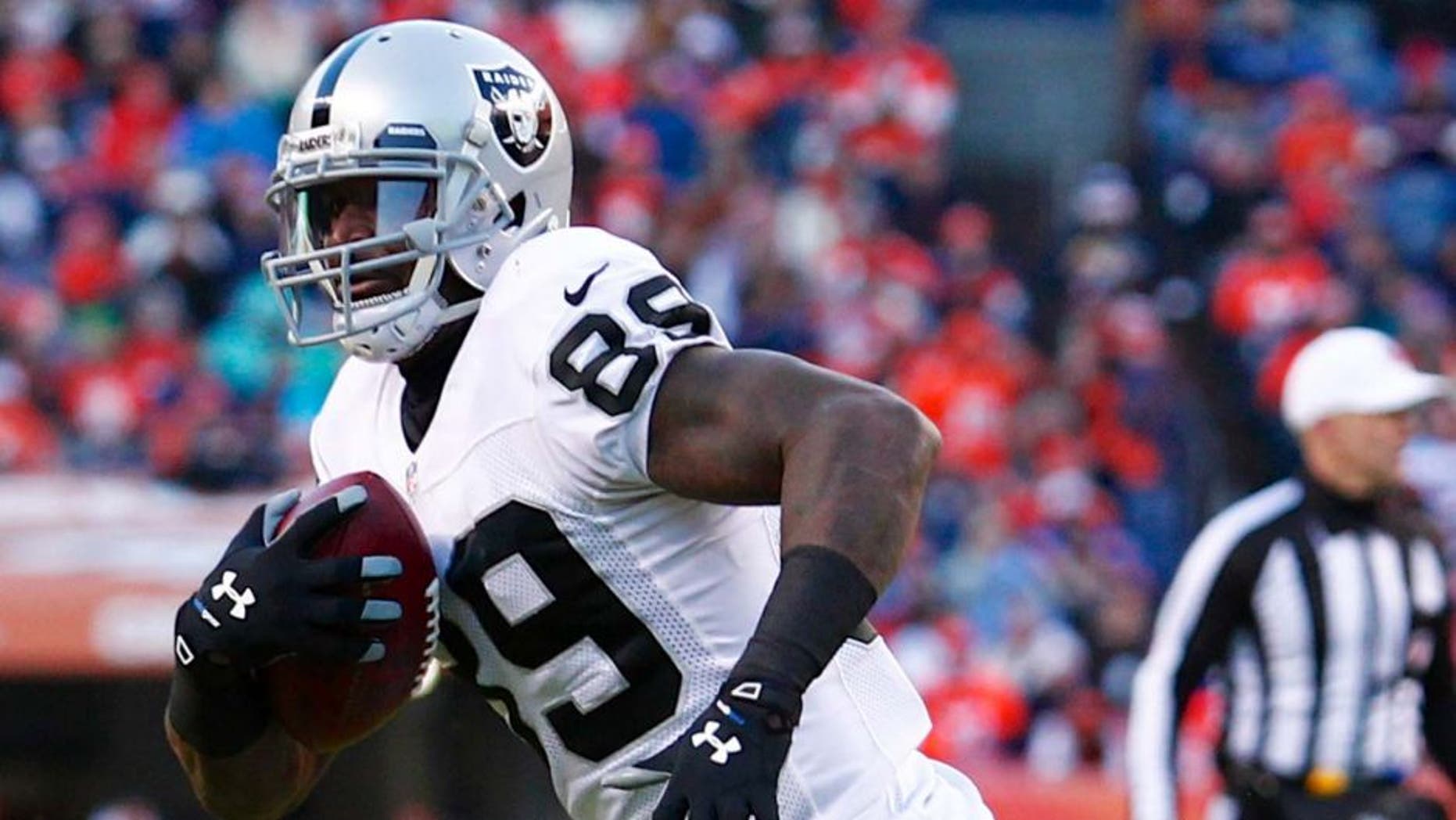 Oakland Raiders wide receiver James Jones runs the ball in the third quarter Dec 28, 2014, against the Broncos in Denver.