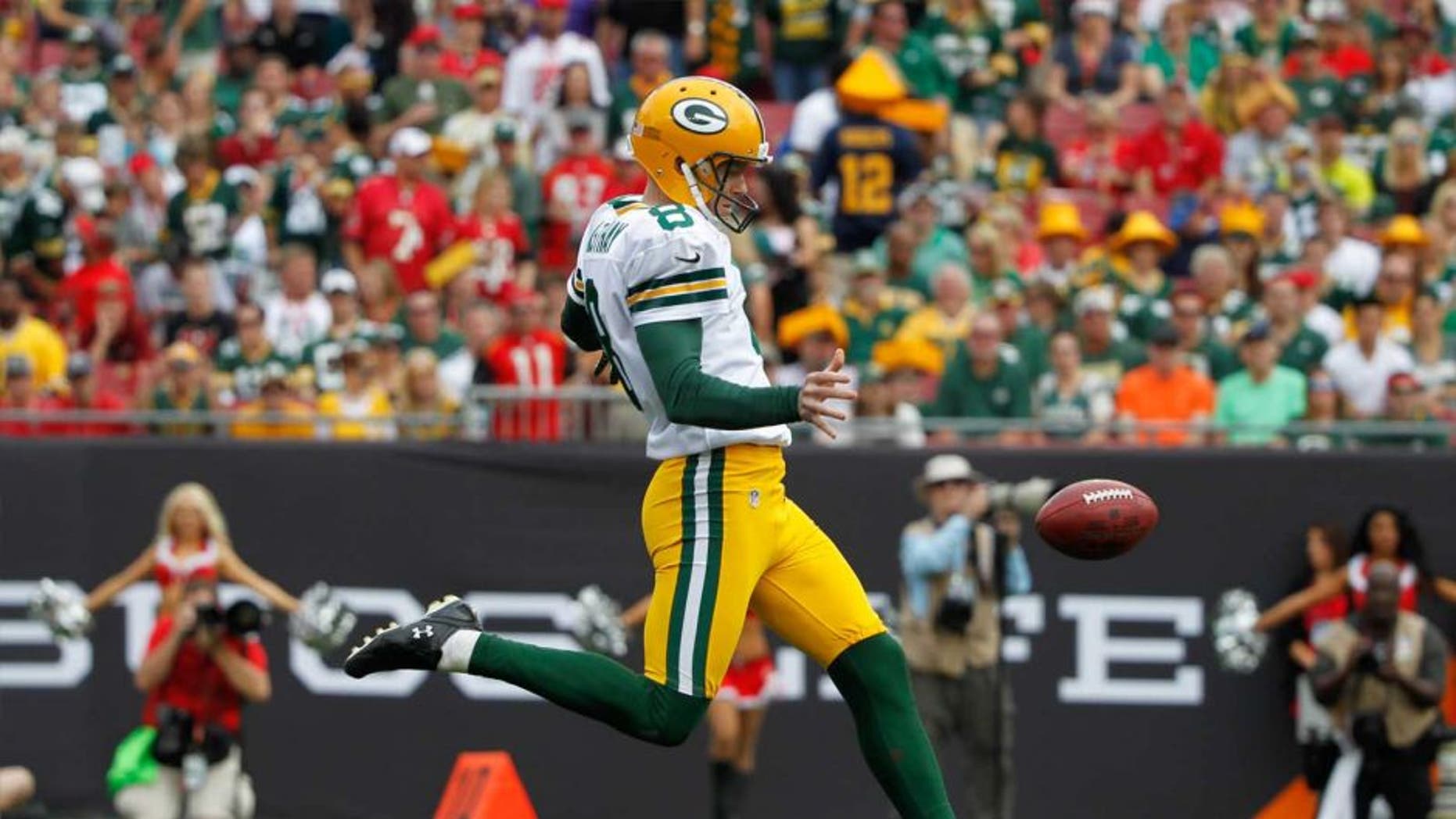 Green Bay Packers punter Tim Masthay punts the ball against the Tampa Bay Buccaneers during the first quarter at Raymond James Stadium on Dec. 21, 2014.