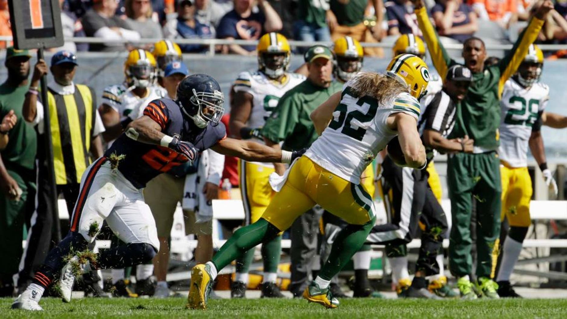 Green Bay Packers linebacker Clay Matthews runs after intercepting a pass intended for Chicago Bears running back Matt Forte during the second half of an NFL football game, Sunday, Sept. 13, 2015, in Chicago.
