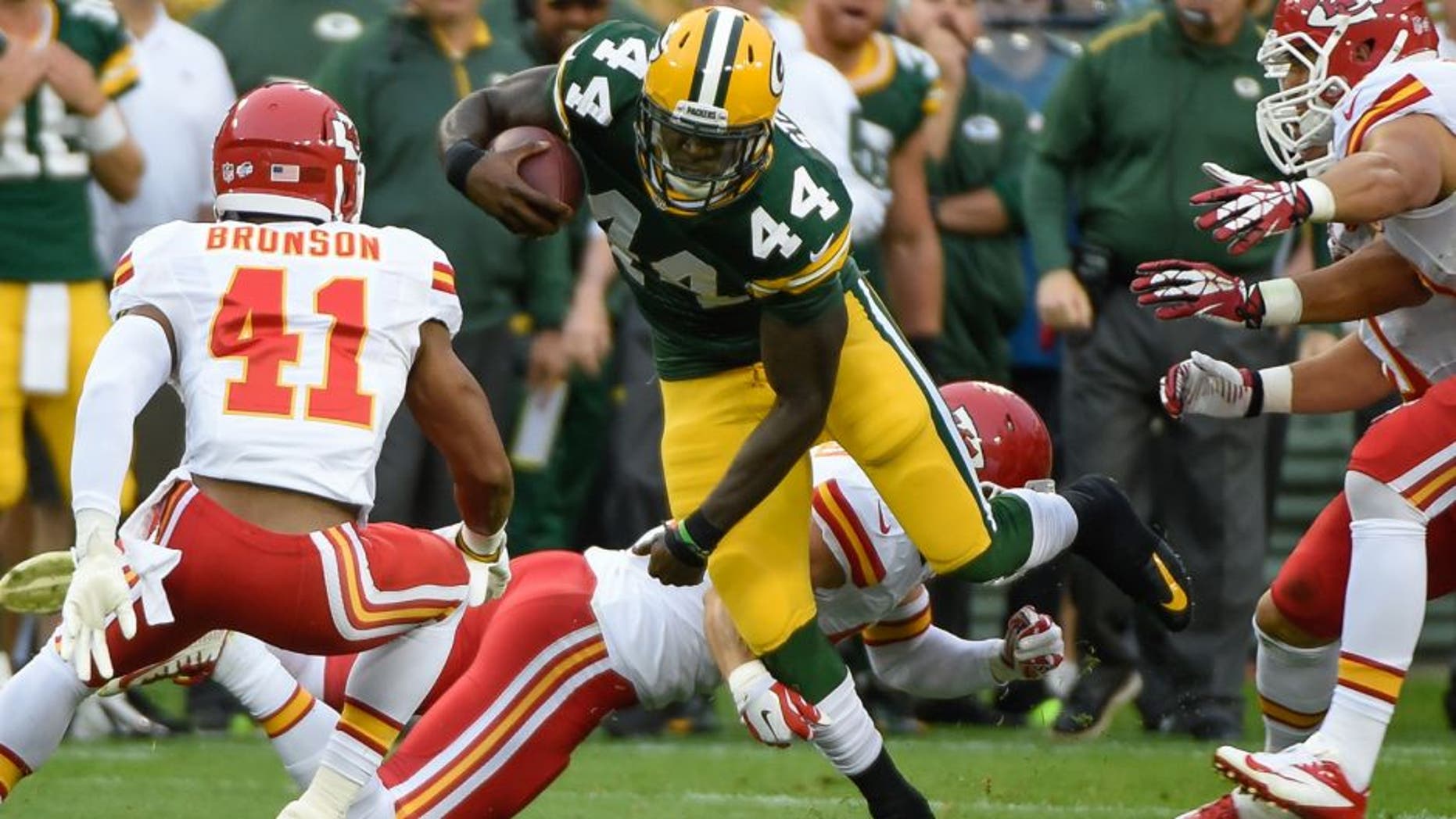 Aug 28, 2014; Green Bay, WI, USA; Green Bay Packers running back James Starks (44) runs with the ball as Kansas City Chiefs defensive back Malcolm Bronson (41) chases in the first quarter at Lambeau Field. Mandatory Credit: Benny Sieu-USA TODAY Sports