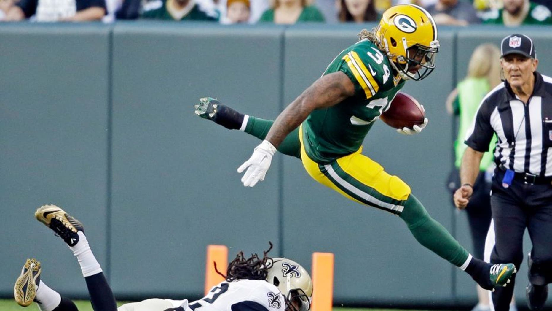Green Bay Packers' Rajion Neal runs back a kickoff during the first half of an NFL preseason football game against the New Orleans Saints Thursday, Sept. 3, 2015, in Green Bay, Wis. (AP Photo/Jeffrey Phelps)