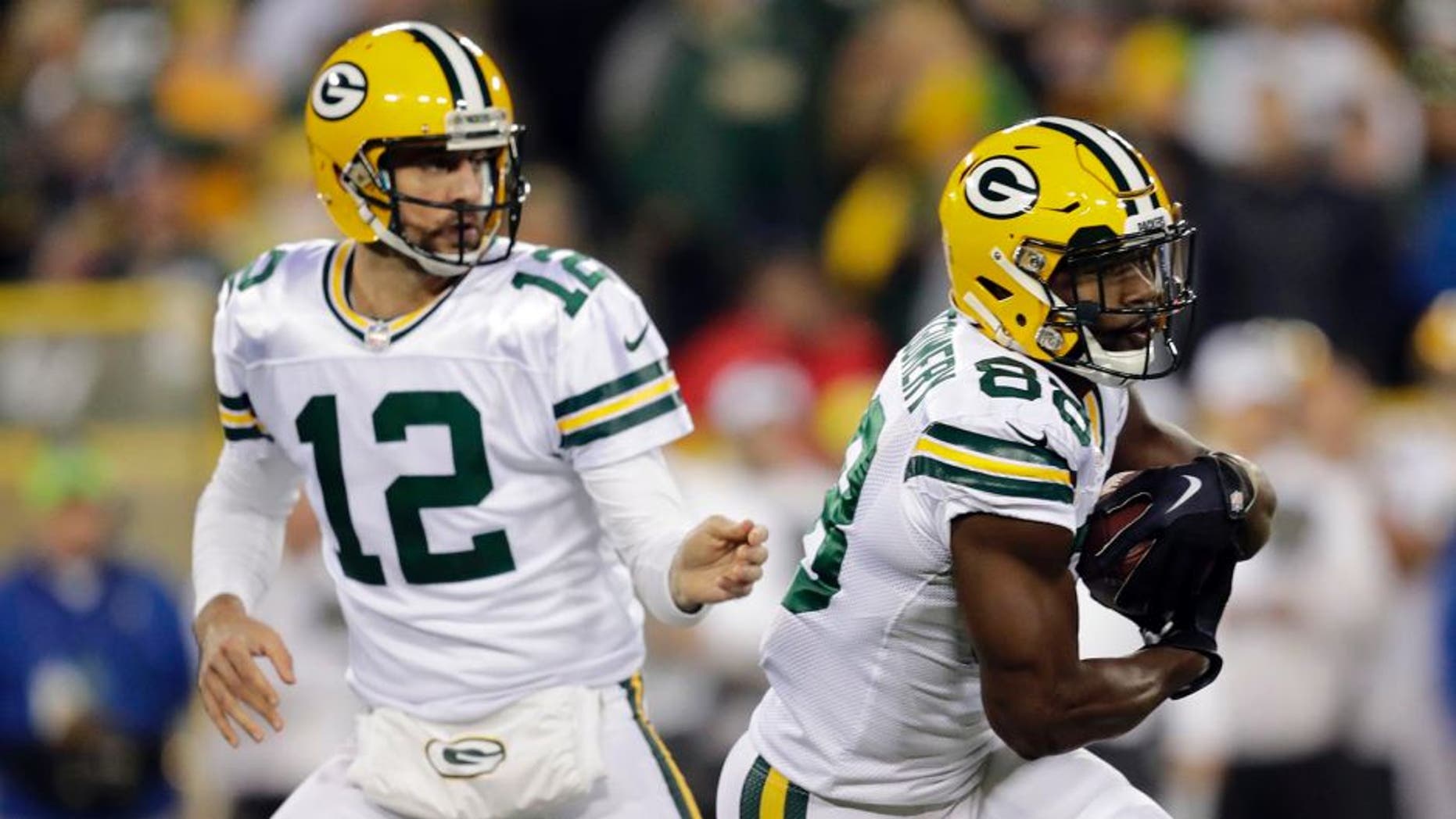 Oct 20, 2016; Green Bay, WI, USA; Green Bay Packers quarterback Aaron Rodgers (12) hands off the ball to wide receiver Ty Montgomery (88) in the first quarter against the Chicago Bears at Lambeau Field. Mandatory Credit: Dan Powers/The Post-Crescent via USA TODAY Sports