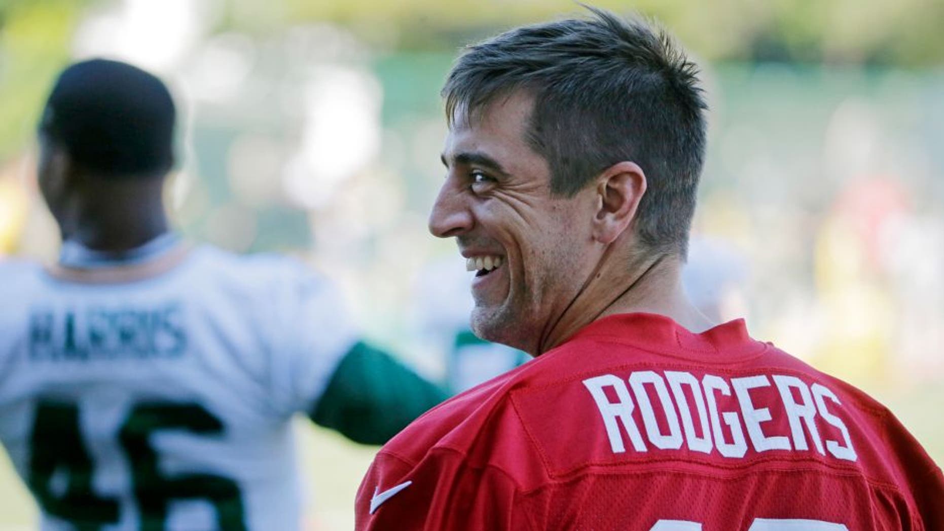 Green Bay Packers' Aaron Rodgers smiles during NFL football minicamp, Tuesday, June 16, 2015, in Green Bay, Wis. (AP Photo/Morry Gash)