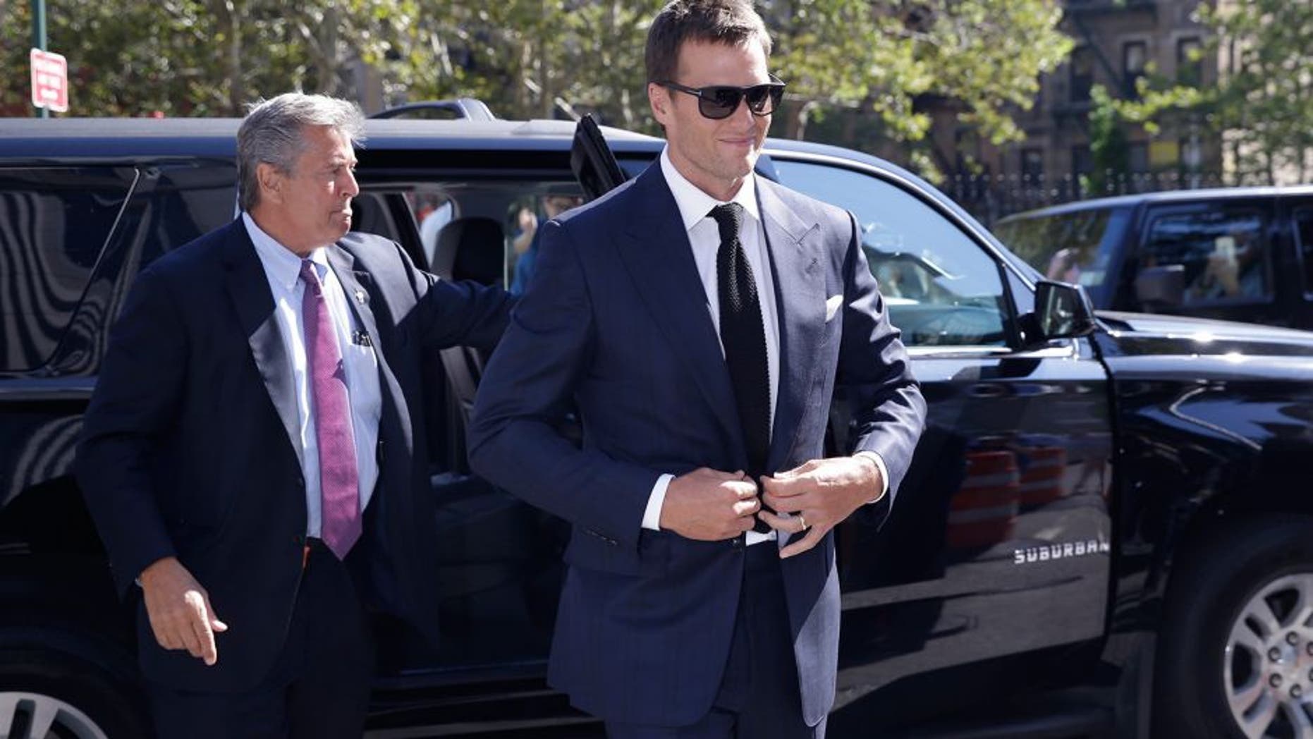 New England Patriots quarterback Tom Brady arrives at federal court, Wednesday, Aug. 12, 2015, in New York. Brady and NFL Commissioner Roger Goodell are set to explain to a judge why a controversy over underinflated footballs at last season's AFC conference championship game is spilling into a new season. (AP Photo/Mary Altaffer)