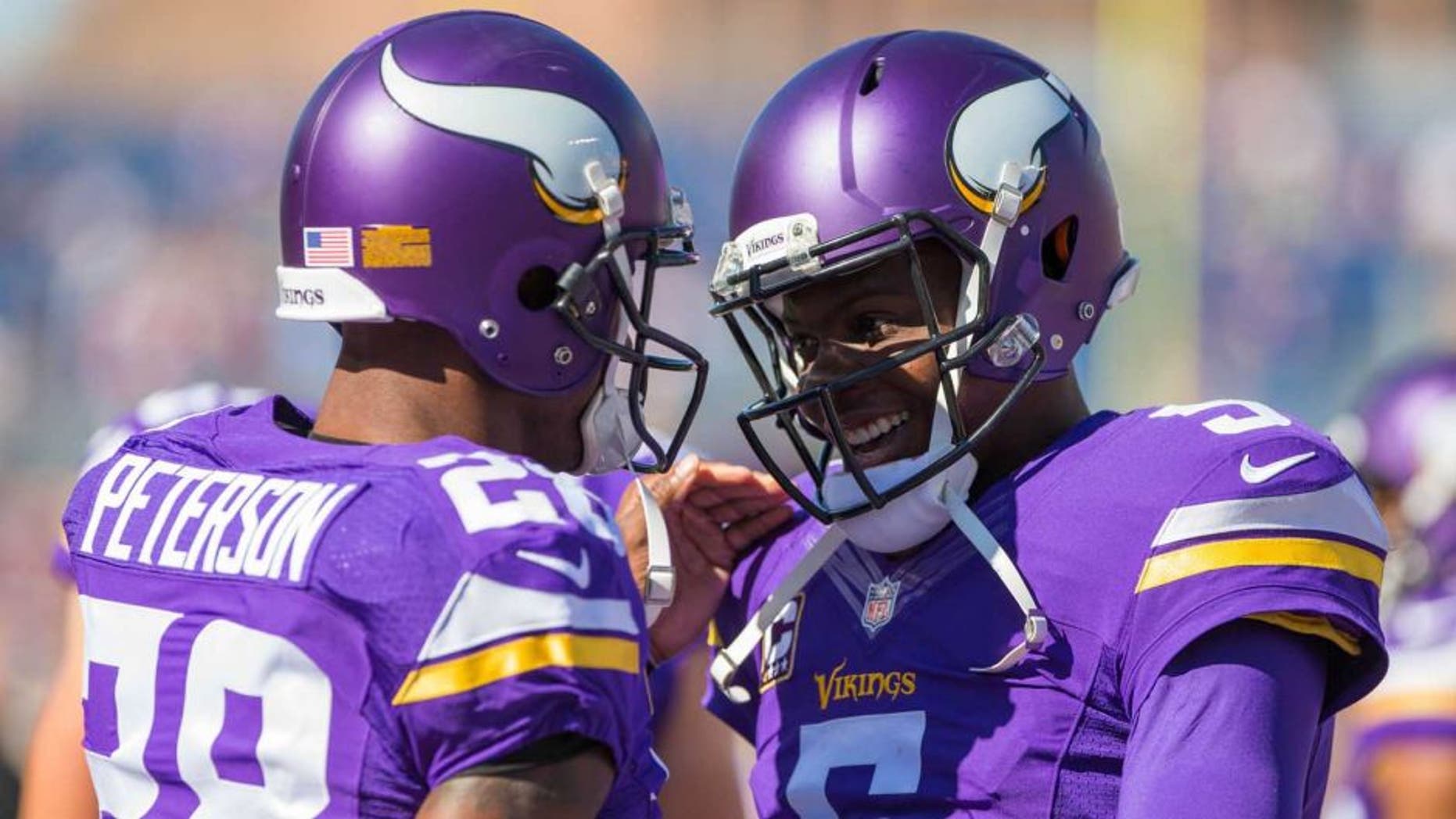 Minnesota Vikings quarterback Teddy Bridgewater and running back Adrian Peterson smile before the game the San Diego Chargers at TCF Bank Stadium in Minneapolis on Sunday, Sept. 27, 2015.