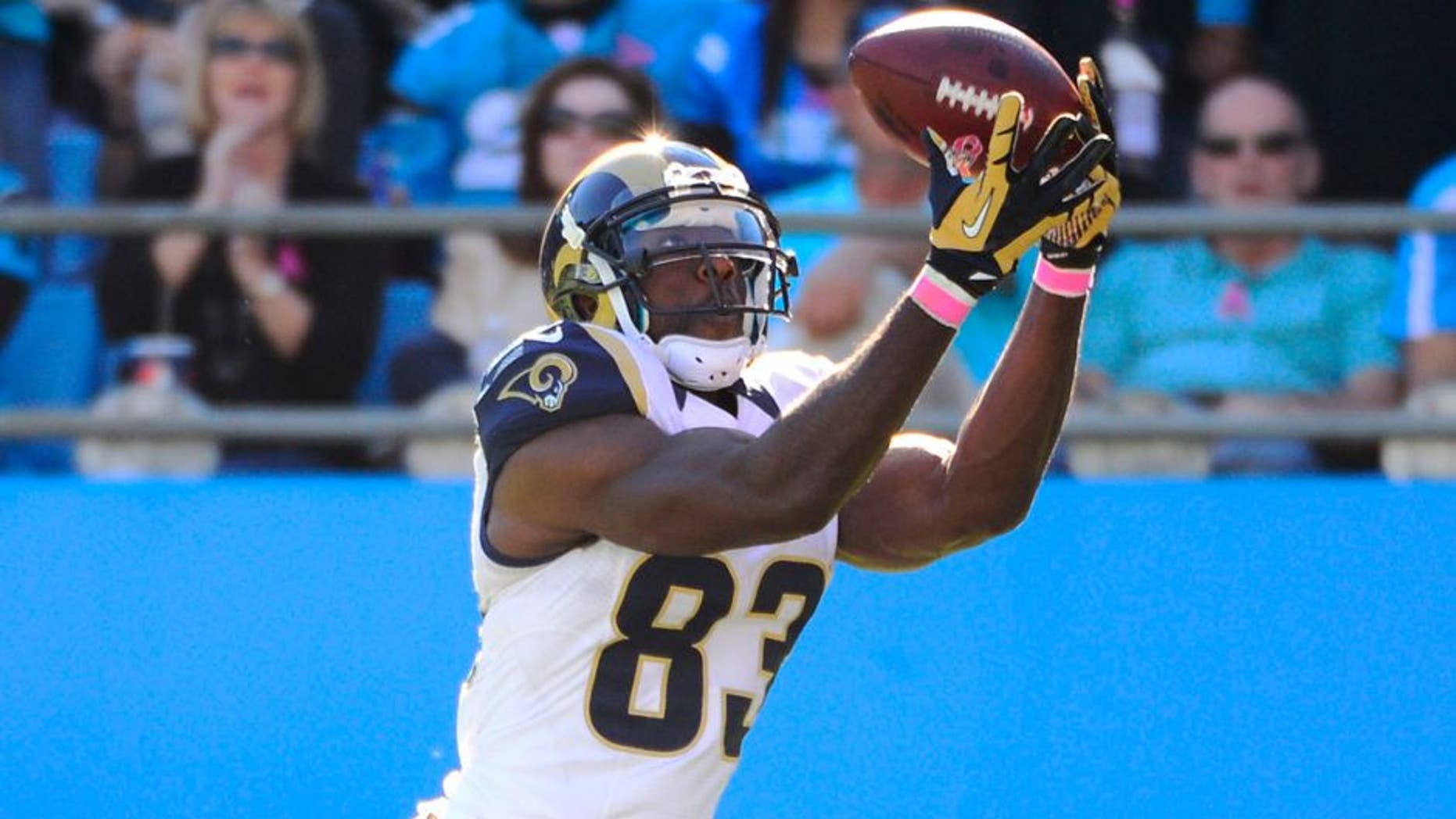 Oct 20, 2013; Charlotte, NC, USA; St. Louis Rams wide receiver Brian Quick (83) drops a pass in the end zone as Carolina Panthers cornerback Melvin White (23) defends in the fourth quarter. The Carolina Panthers defeated the St. Louis Rams 30-15 at Bank of America Stadium. Mandatory Credit: Bob Donnan-USA TODAY Sports