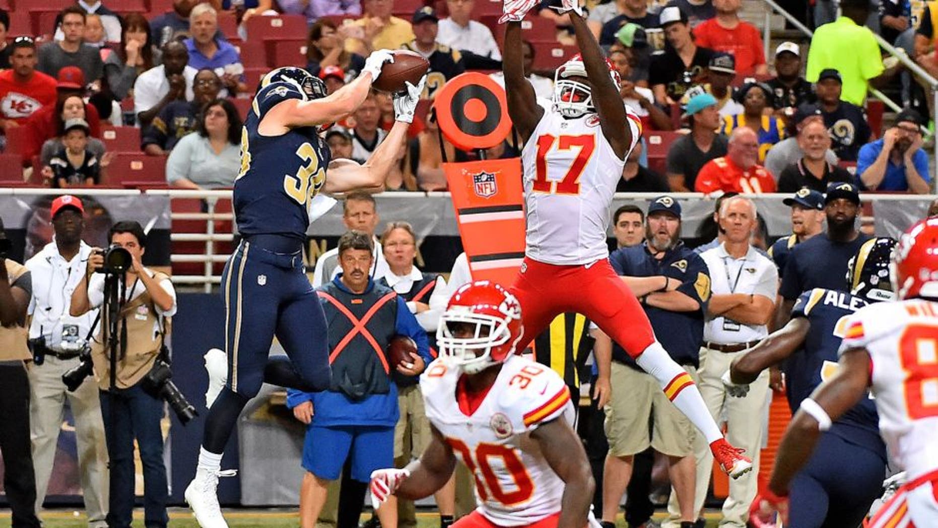 Sep 3, 2015; St. Louis, MO, USA; St. Louis Rams defensive back Cody Davis (38) intercepts a pass thrown by Kansas City Chiefs quarterback Chase Daniel (not pictured) and runs the ball back for a touch down during the first half at the Edward Jones Dome. Mandatory Credit: Jasen Vinlove-USA TODAY Sports