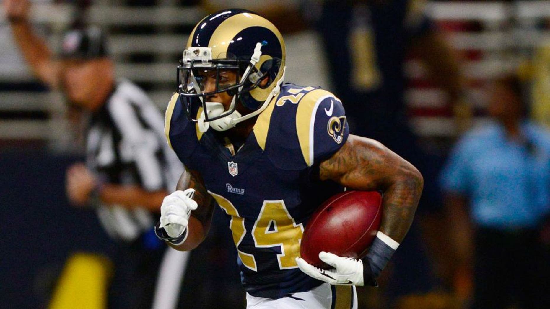 Aug 29, 2013; St. Louis, MO, USA; St. Louis Rams running back Isaiah Pead (24) returns a kick off against the Baltimore Ravens during the first half at Edward Jones Dome. Mandatory Credit: Jeff Curry-USA TODAY Sports