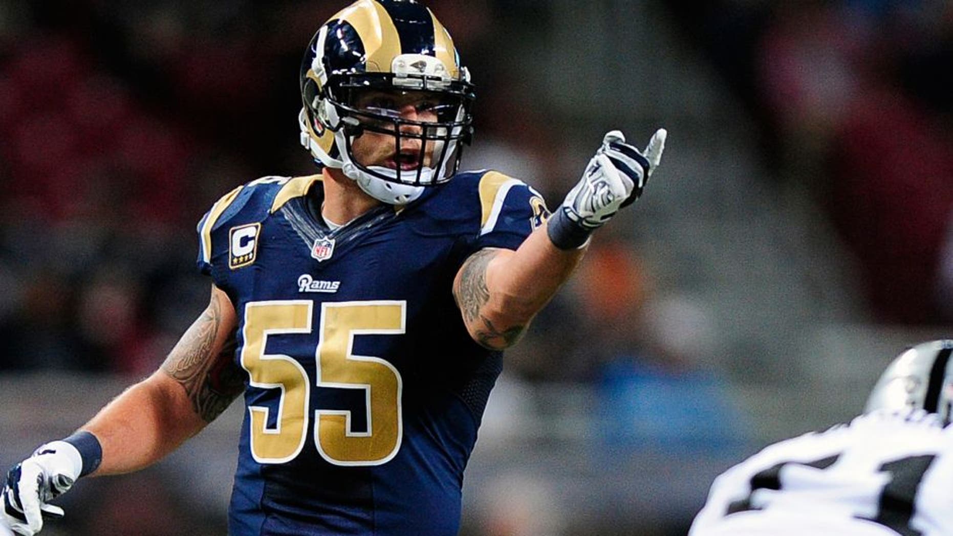 Nov 30, 2014; St. Louis, MO, USA; St. Louis Rams middle linebacker James Laurinaitis (55) calls a play during the first half against the Oakland Raiders at the Edward Jones Dome. St. Louis defeated Oakland 52-0. Mandatory Credit: Jeff Curry-USA TODAY Sports