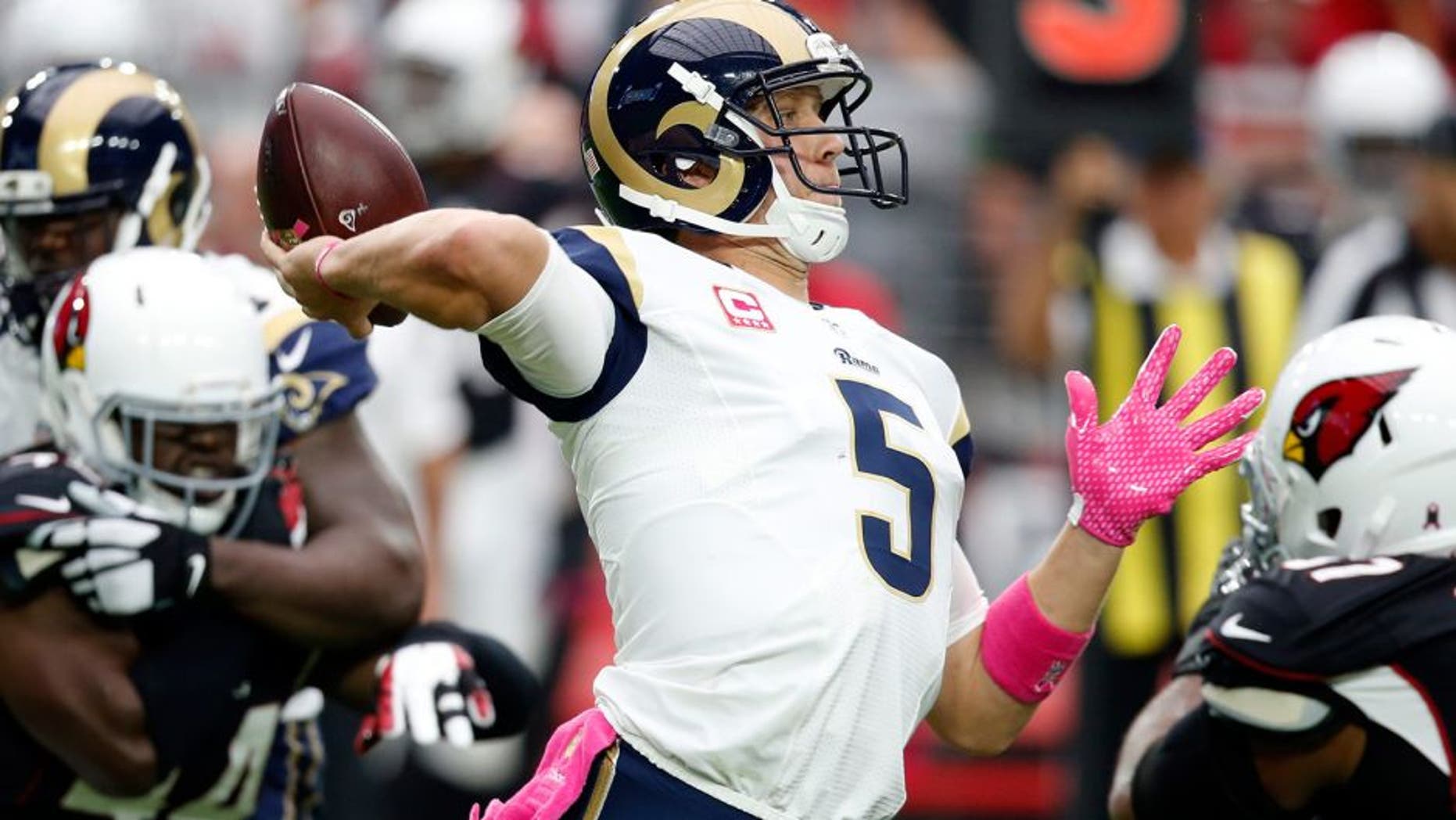 St. Louis Rams quarterback Nick Foles (5) throws against the Arizona Cardinals during the first half of an NFL football game, Sunday, Oct. 4, 2015, in Glendale, Ariz. (AP Photo/Ross D. Franklin)
