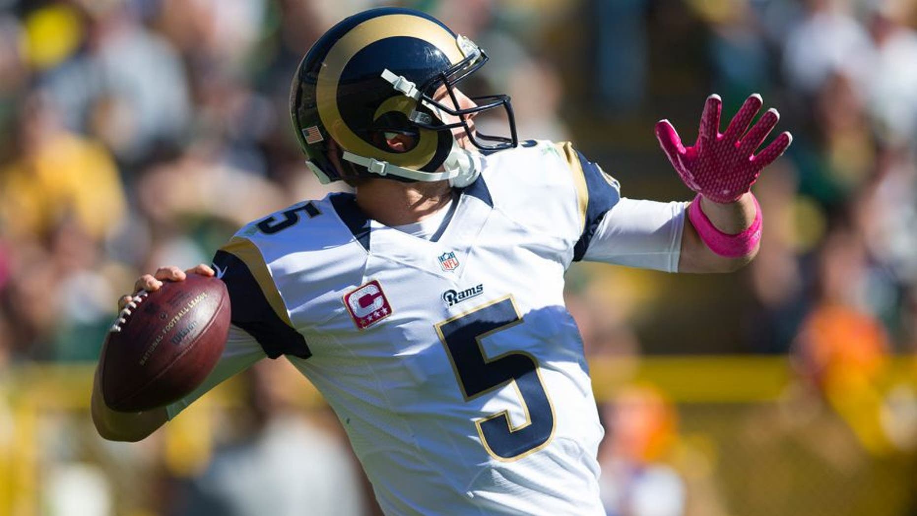 Oct 11, 2015; Green Bay, WI, USA; St. Louis Rams quarterback Nick Foles (5) throws a pass during the second quarter against the Green Bay Packers at Lambeau Field. Mandatory Credit: Jeff Hanisch-USA TODAY Sports