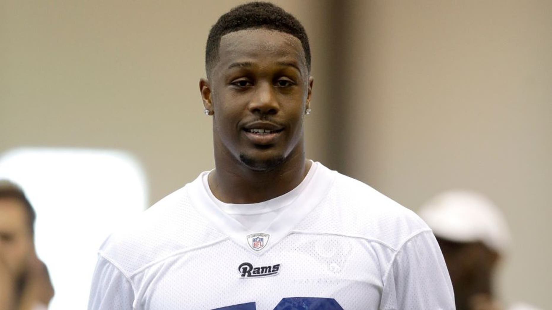 St. Louis Rams linebacker Akeem Ayers walks off the field at the end of practice during an NFL football organized team activity, Thursday, June 18, 2015, in St. Louis. (AP Photo/Jeff Roberson)