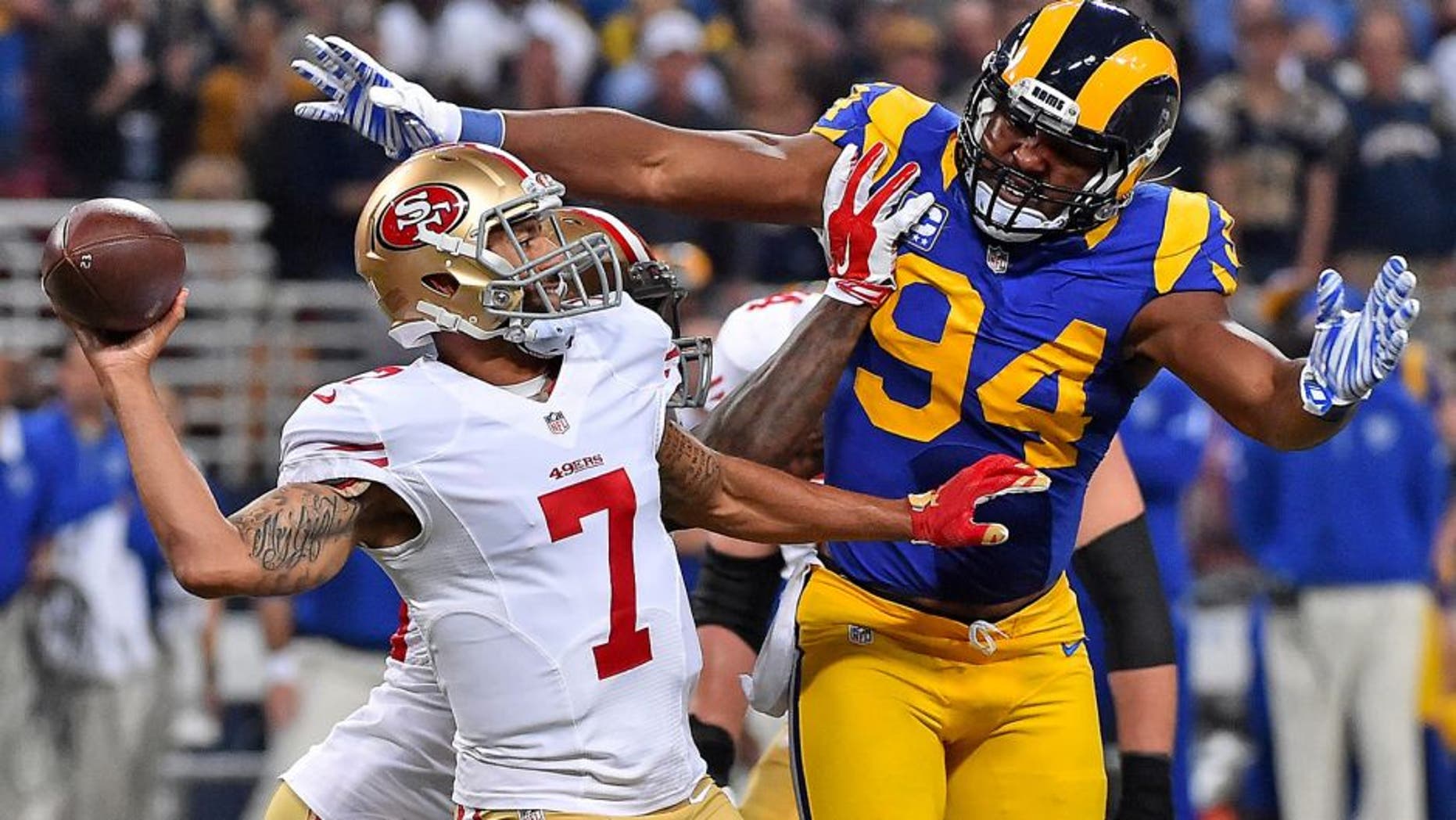 Nov 1, 2015; St. Louis, MO, USA; St. Louis Rams defensive end Robert Quinn (94) pressures San Francisco 49ers quarterback Colin Kaepernick (7) during the first half at the Edward Jones Dome. Mandatory Credit: Jasen Vinlove-USA TODAY Sports