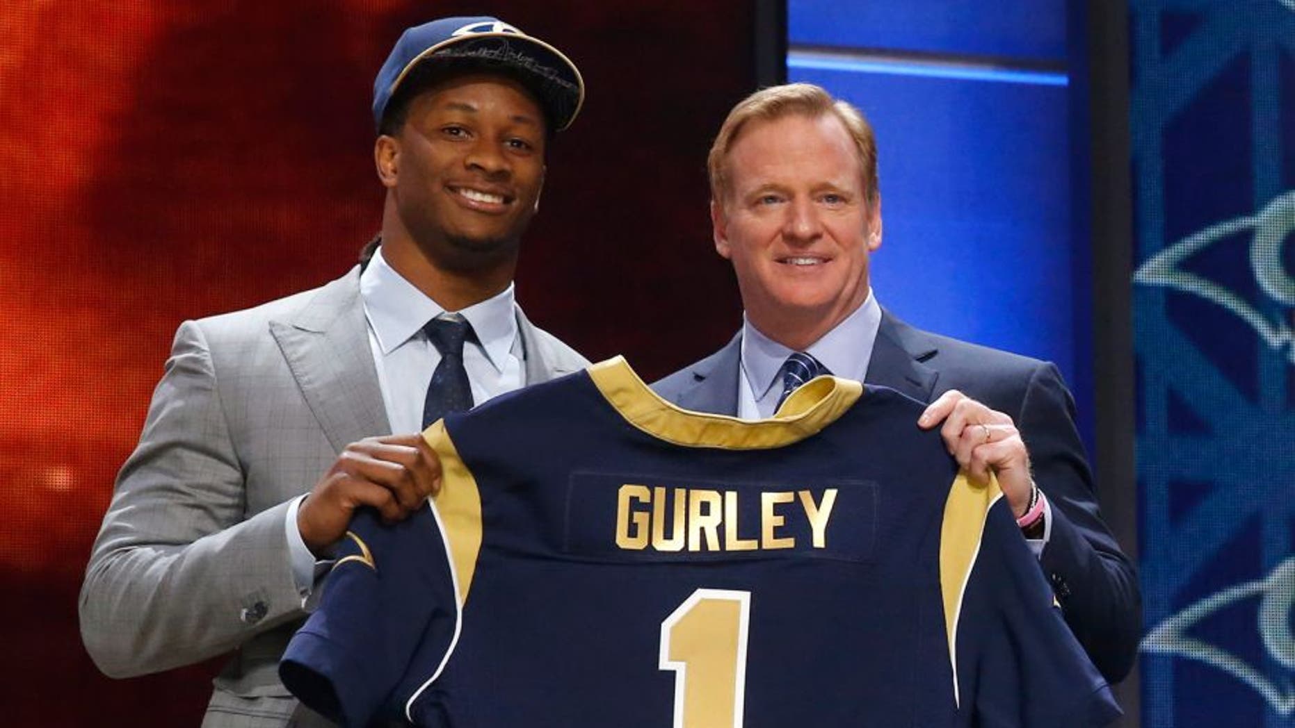 Georgia running back Todd Gurley poses for photos with NFL commissioner Roger Goodell after being selected by the St. Louis Rams as the 10th pick in the first round of the 2015 NFL Draft, Thursday, April 30, 2015, in Chicago. (AP Photo/Charles Rex Arbogast)