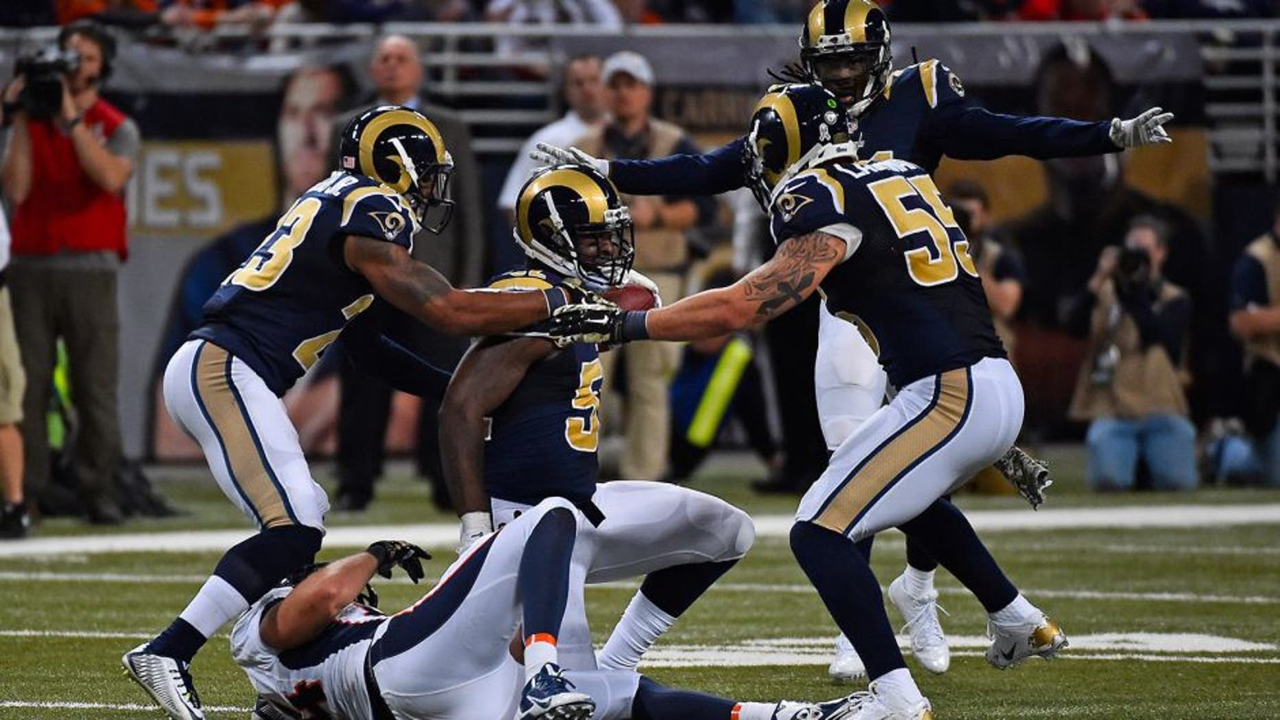 Nov 16, 2014; St. Louis, MO, USA; St. Louis Rams outside linebacker Alec Ogletree (52) reacts after intercepting a pass from Denver Broncos quarterback Peyton Manning (not pictured) during the second half at the Edward Jones Dome. The Rams won 22-7. Mandatory Credit: Jasen Vinlove-USA TODAY Sports